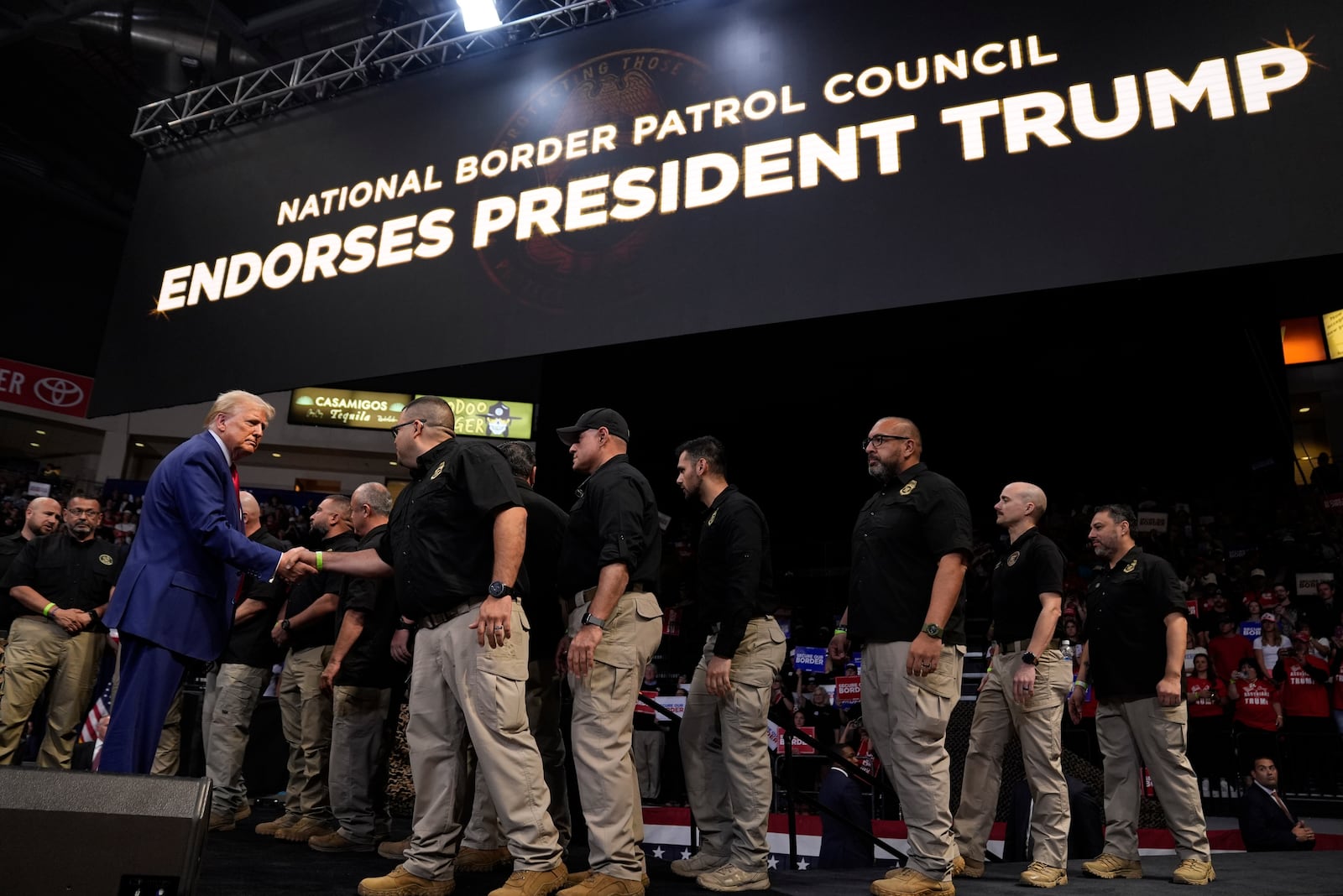 Republican presidential nominee former President Donald Trump greets members of the U.S. Border Patrol as he speaks at a campaign rally at the Findlay Toyota Arena Sunday, Oct. 13, 2024, in Prescott Valley, Ariz. (AP Photo/Evan Vucci)