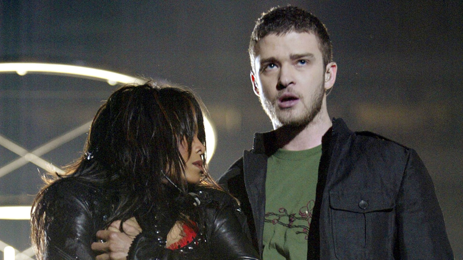 HOUSTON, TX - FEBRUARY 1:  Singers Janet Jackson and surprise guest Justin Timberlake perform during the halftime show at Super Bowl XXXVIII between the New England Patriots and the Carolina Panthers at Reliant Stadium on February 1, 2004 in Houston, Texas.  At the end of the performance, Timberlake tore away a piece of Jackson's outfit.