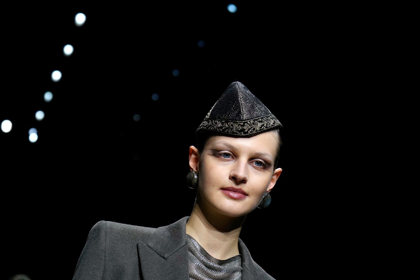 A model wears a creation as part of the Giorgio Armani Fall/Winter 2025-2026 Women's collection presented in Milan, Italy, Sunday, March 2, 2025. (AP Photo/Luca Bruno)