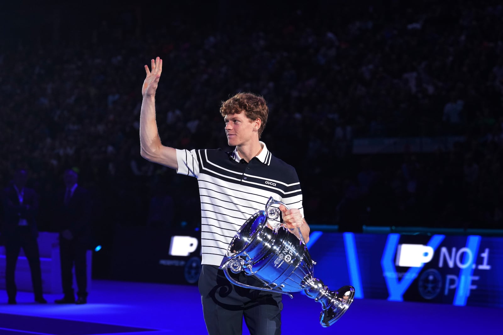 Italy's Jannik Sinner holds the trophy as ATP world best player at the ATP World Tour Finals at the Inalpi Arena, in Turin, Italy, Monday, Nov. 11, 2024. Sinner was presented with the trophy for finishing the year ranked No. 1. (AP Photo/Antonio Calanni)