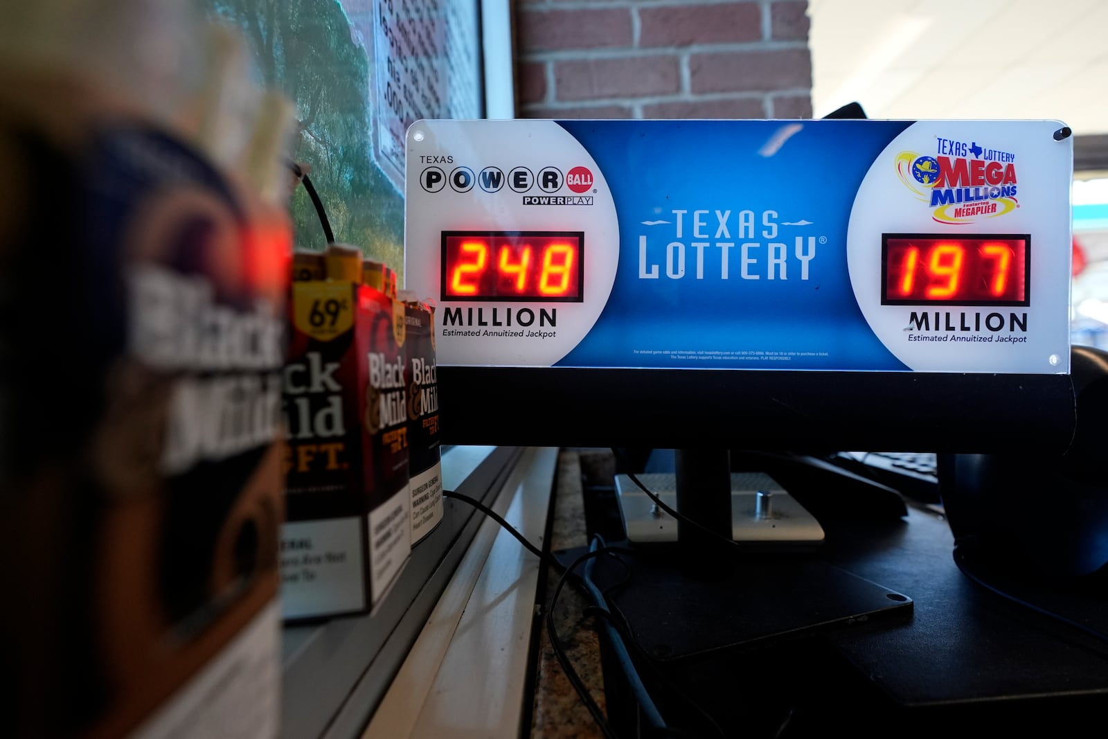 A Texas Lottery sales terminal shows the jackpot amounts up to win at Fuel City in Dallas, Wednesday, Feb. 26, 2025. (AP Photo/LM Otero)