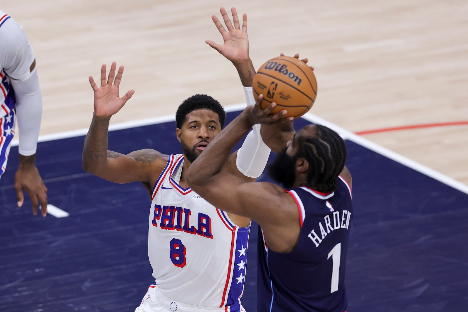 Philadelphia 76ers forward Paul George (8) defends against Los Angeles Clippers guard James Harden (1) during the first half of an NBA basketball game, Wednesday, Nov. 6, 2024, in Inglewood, Calif. (AP Photo/Ryan Sun)