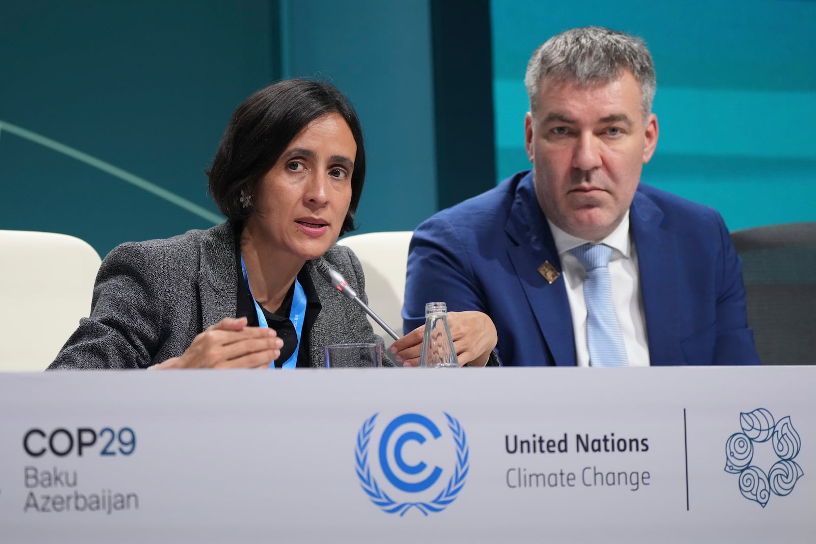 Susana Muhamad, environment minister of Colombia, left, speaks at a session next to Denmark Climate Minister Lars Aagaard during a session at the COP29 U.N. Climate Summit, Thursday, Nov. 21, 2024, in Baku, Azerbaijan. (AP Photo/Sergei Grits)