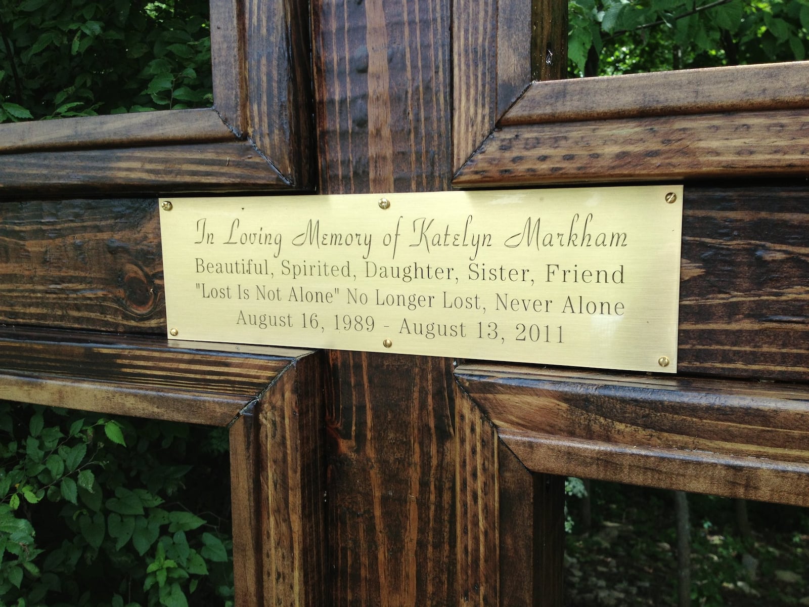 A memorial cross was placed in memory of Katelyn Markham by family members at the site where her remains were found in Cedar Grove, Ind.