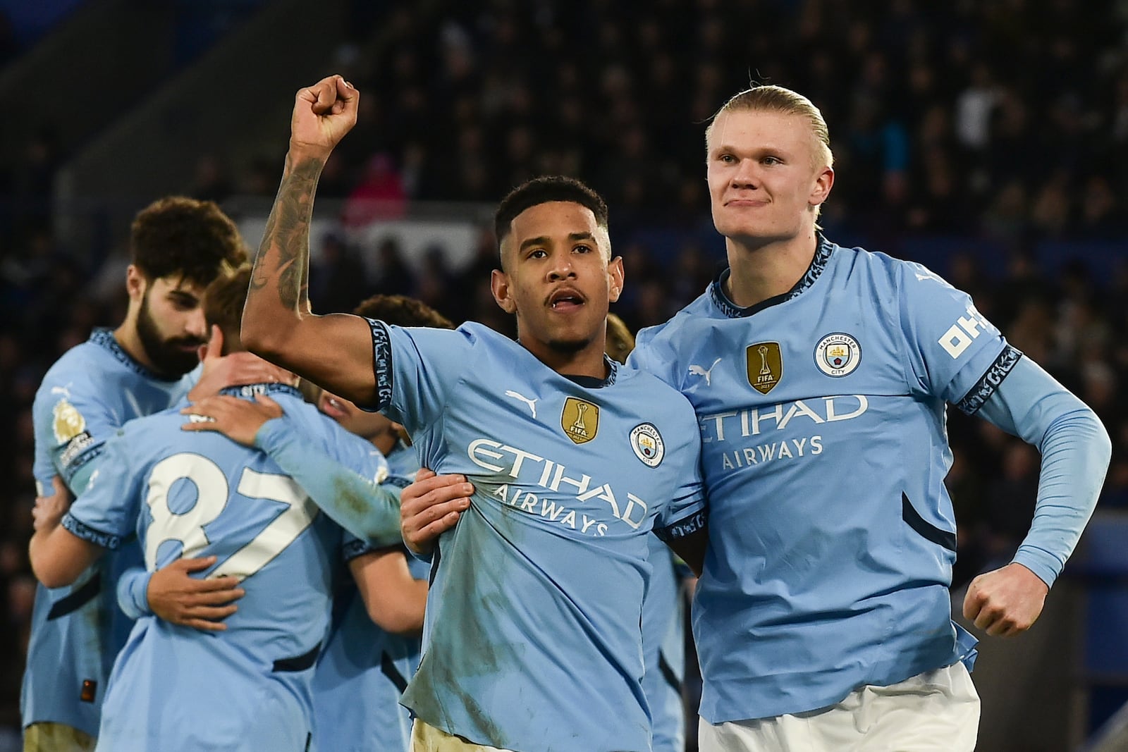 Manchester City's Erling Haaland, right, celebrates with Manchester City's Savinho after scoring his side's second goal during the English Premier League soccer match between Leicester City and Manchester City at King Power stadium in Leicester, England, Sunday, Dec. 29, 2024. (AP Photo/Rui Vieira)