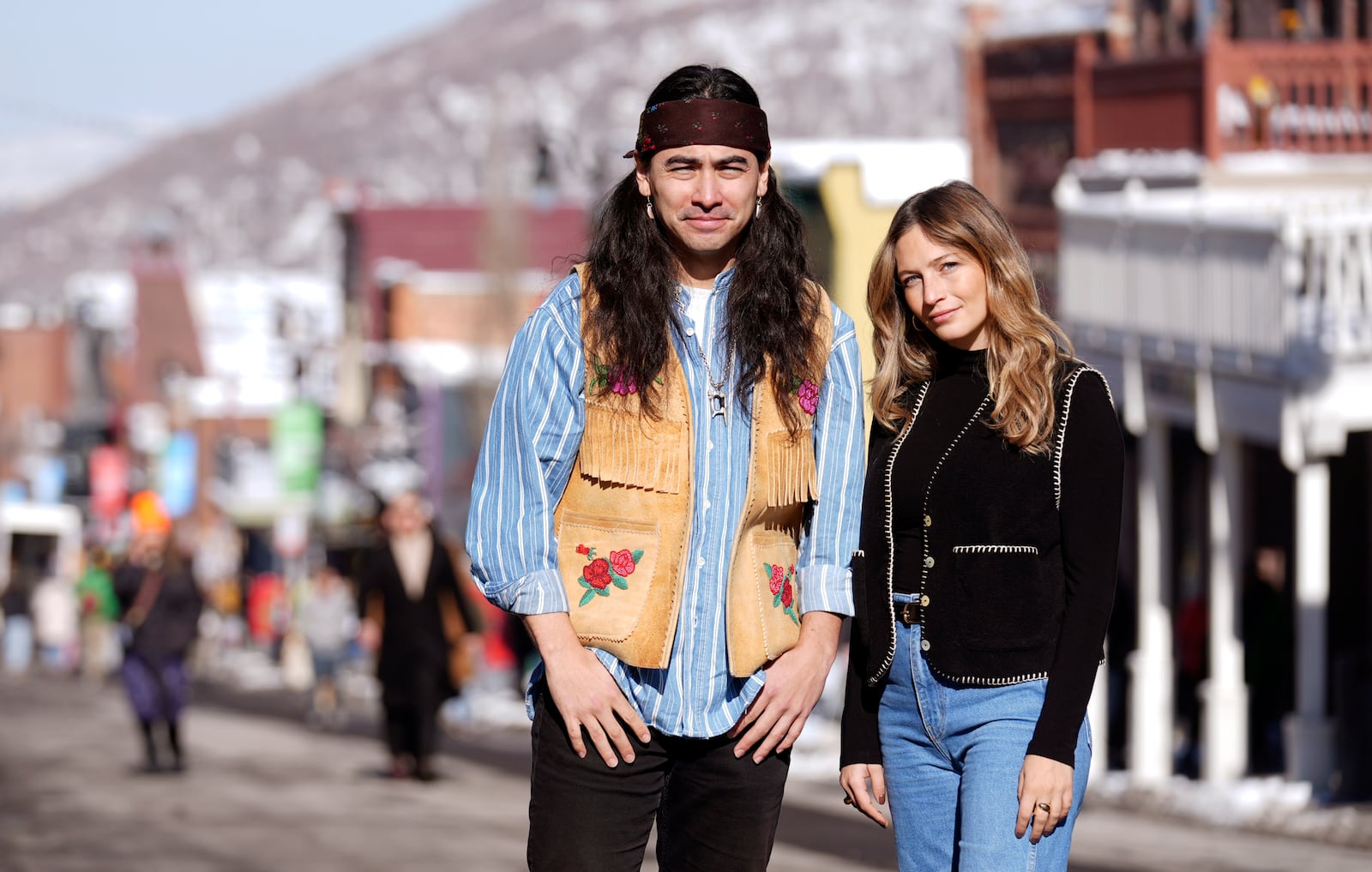 Julian Brave NoiseCat, left, and Emily Kassie, co-directors of the Oscar-nominated documentary film "Sugarcane," pose for a portrait on Main Street during the Sundance Film Festival on Monday, Jan. 27, 2025, in Park City, Utah. (AP Photo/Chris Pizzello)