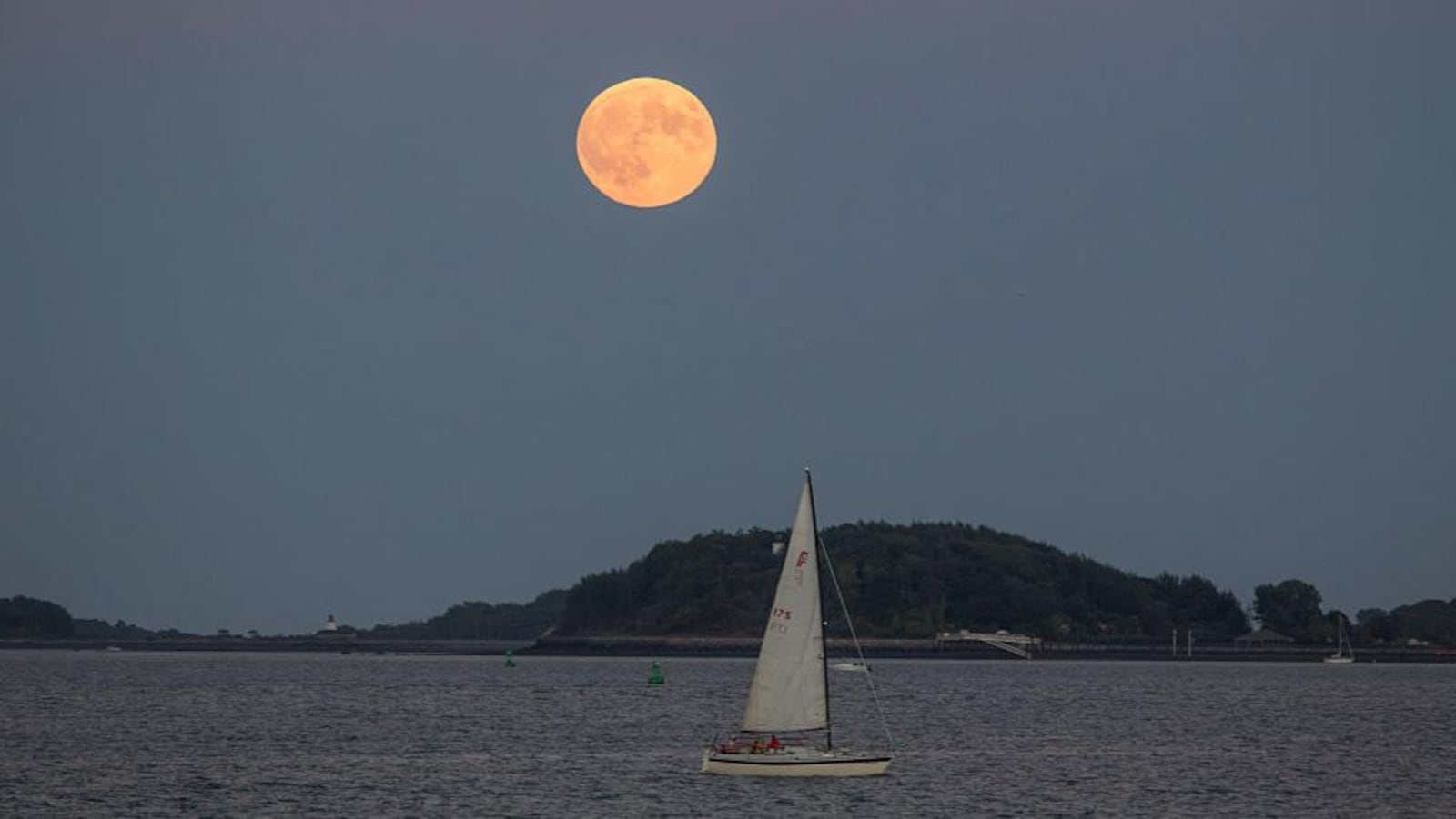 A supermoon rises over Boston Harbor on September 27, 2015 in Boston, Massachusetts.