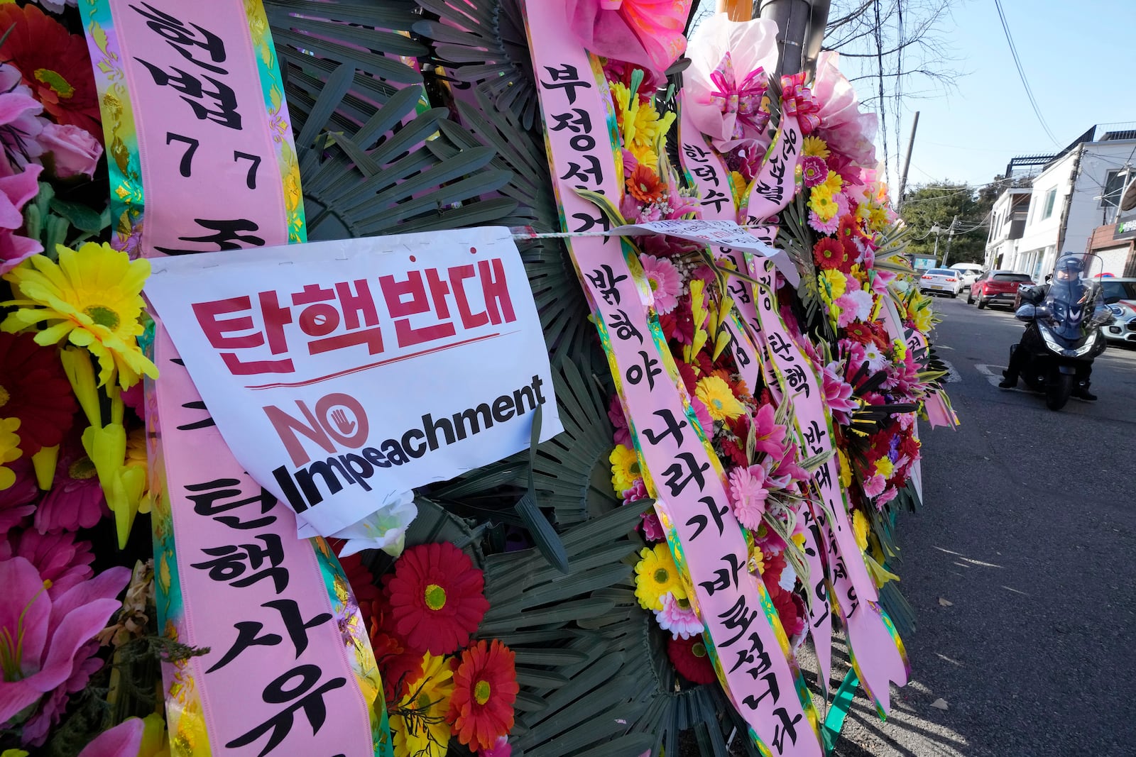 FILE- Wreaths sent by supporters of impeached South Korean President Yoon Suk Yeol are displayed outside the Constitutional Court in Seoul, South Korea, Dec. 27, 2024. (AP Photo/Ahn Young-joon, File)