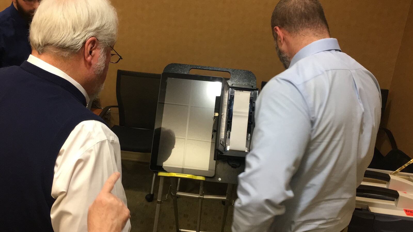 Butler County Board of Elections board members review an electronic voting machine on Monday morning, Jan. 28, 2019, at the board office in Princeton Road in Hamilton. MICHAEL D. PITMAN/STAFF