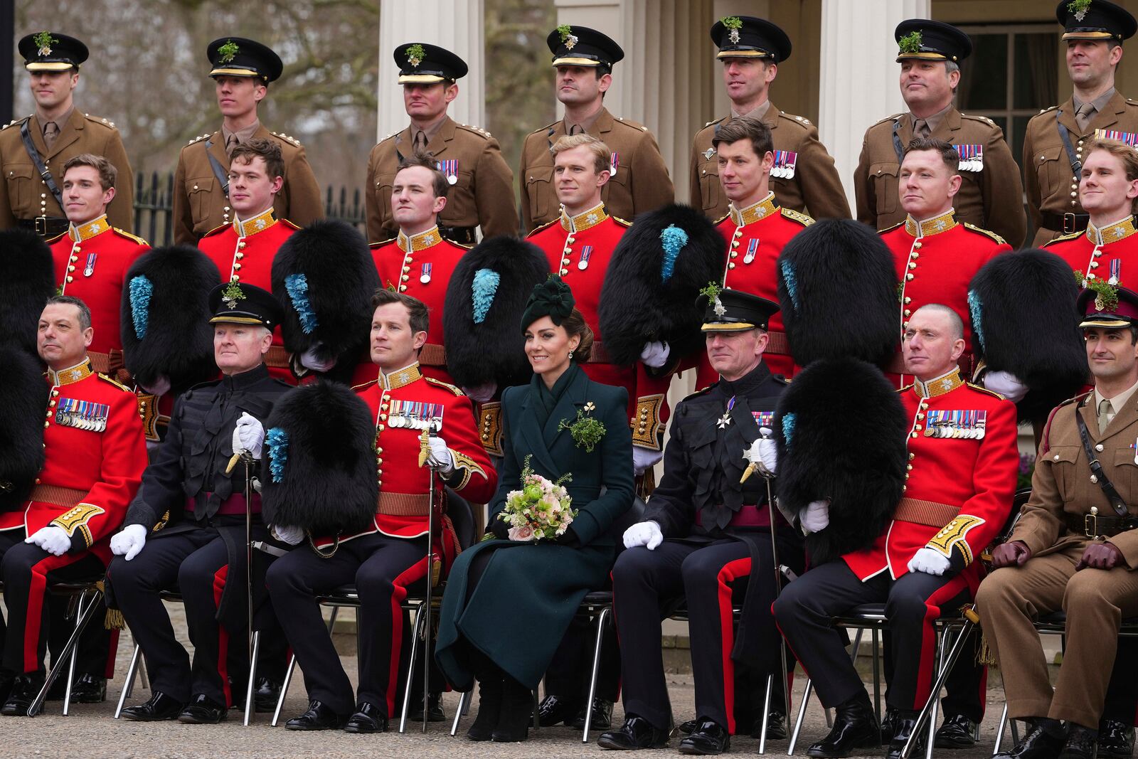 Britain's Kate, the Princess of Wales, poses for a photo with members of the Irish Guards at a special St Patrick's Day parade and celebration at Wellington Barracks in London, Monday, March 17, 2025.(AP Photo/Kirsty Wigglesworth)