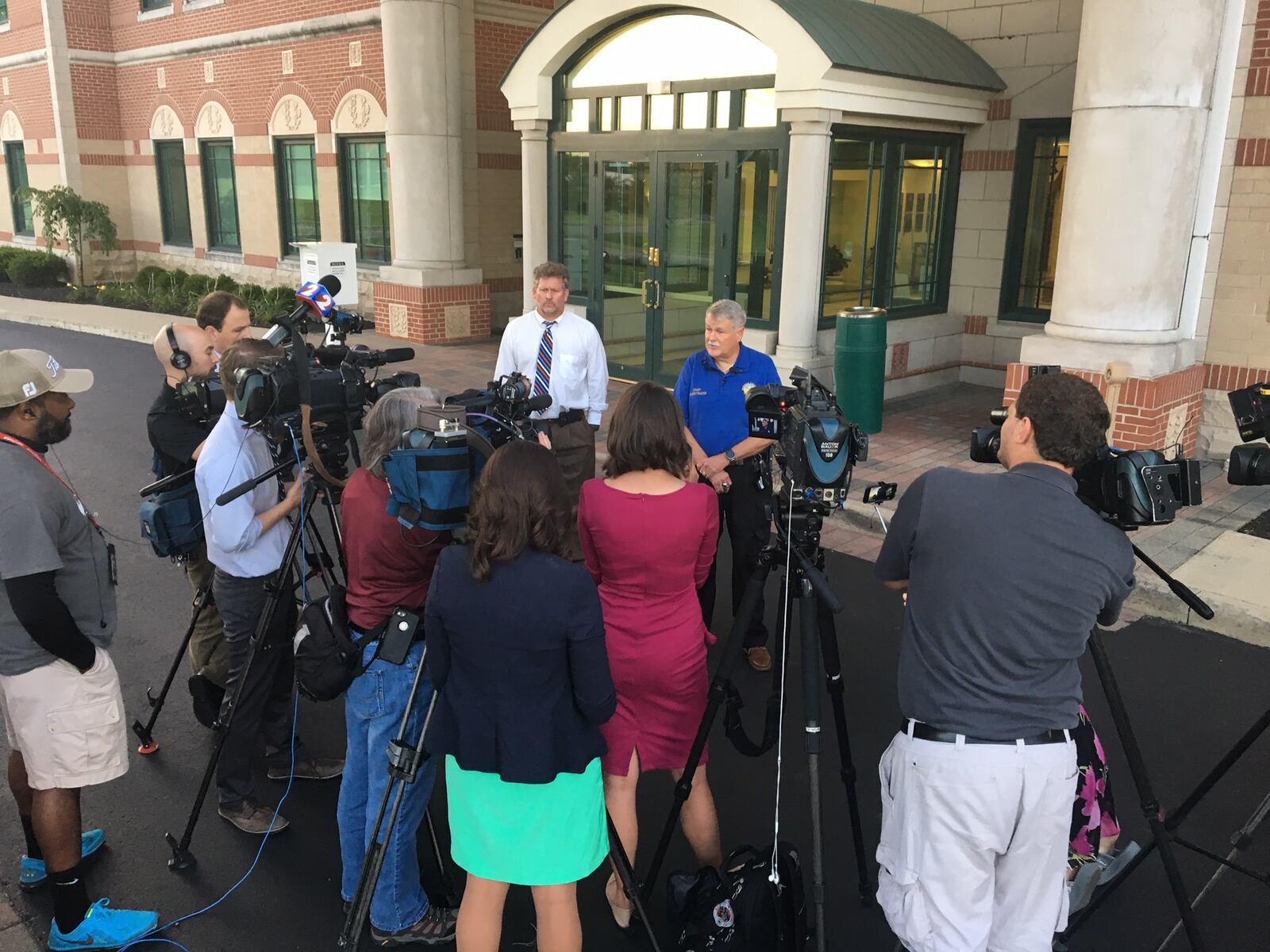 Warren County officials give press update, Aug. 23, 2017, after a child found dead in a car at Procter & Gamble Mason Business Center, 8700 Mason Montgomery Road. MICHAEL BURIANEK/STAFF