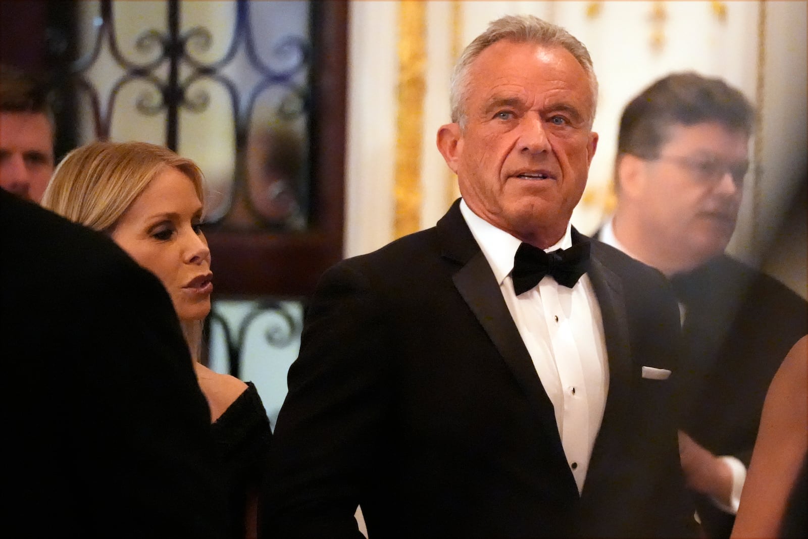 Robert F. Kennedy Jr., and his wife Cheryl Hines arrive before President-elect Donald Trump speaks during an America First Policy Institute gala at his Mar-a-Lago estate, Thursday, Nov. 14, 2024, in Palm Beach, Fla. (AP Photo/Alex Brandon)