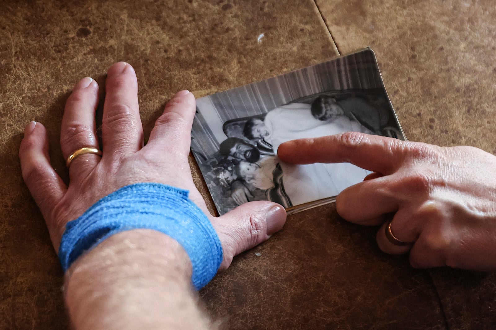 Jake Heinrichs holds a photo of his father who died from Alzheimer's, in New York, on Wednesday, March 12, 2025. (AP Photo/Heather Khalifa)