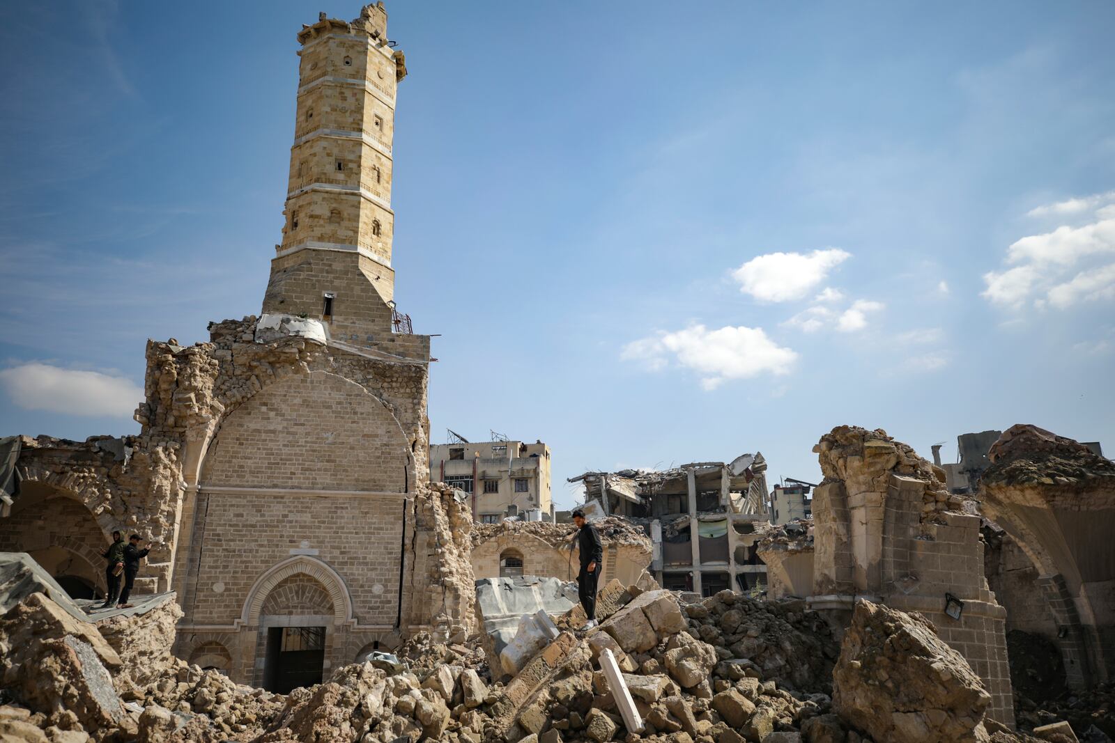 Palestinians gather to attend Friday prayers at the Great Omari Mosque, which was damaged during the Israeli military's air and ground operation in Gaza City, Friday, Feb. 14, 2025. (AP Photo/Jehad Alshrafi)