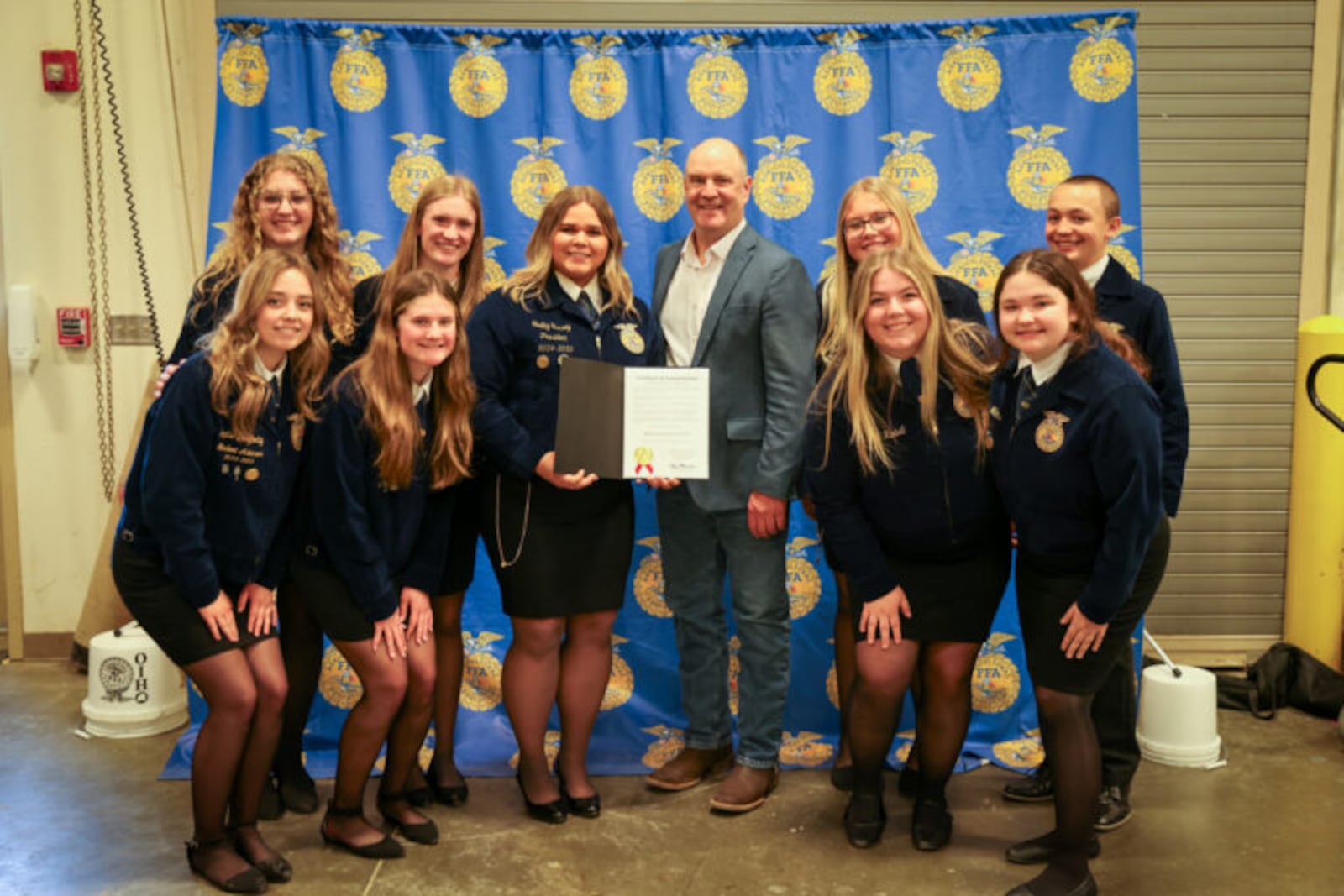 Talawanda High School students in the Butler Tech Future Farmers of America (FFA) recently used a federal grant to help local farmers recharge or replace fire extinguishers – some of which were stored in barns for decades. The teens’ success attracted the attention and visit from Ohio Department of Agriculture Director Brian Baldridge (center with students) from the Ohio Department of Agriculture. (Provided)