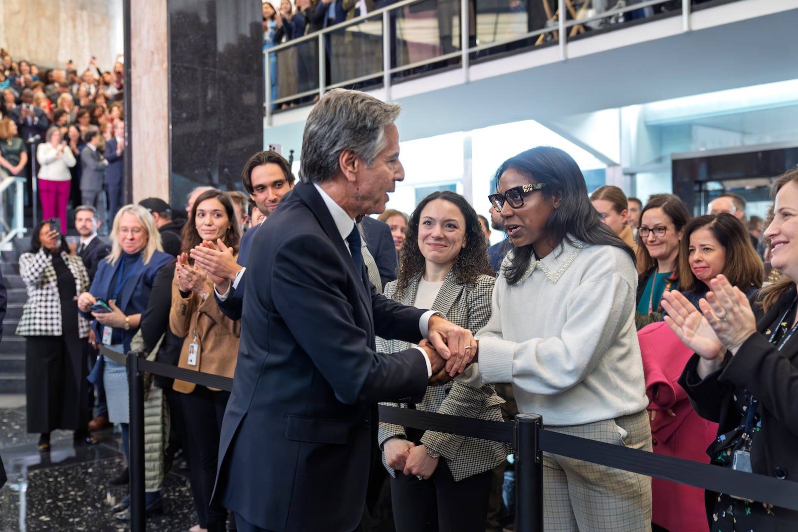 Secretary of State Antony Blinken, left, bids farewell to diplomats and staff at the State Department in Washington, Friday, Jan. 17, 2025. (AP Photo/J. Scott Applewhite)