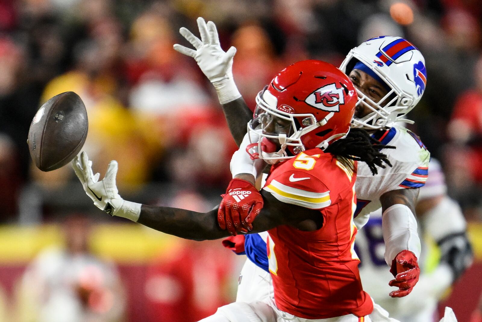 Kansas City Chiefs wide receiver Hollywood Brown (5) works for a catch against Buffalo Bills cornerback Christian Benford (47) during the first half of the AFC Championship NFL football game, Sunday, Jan. 26, 2025, in Kansas City, Mo. (AP Photo/Reed Hoffmann)