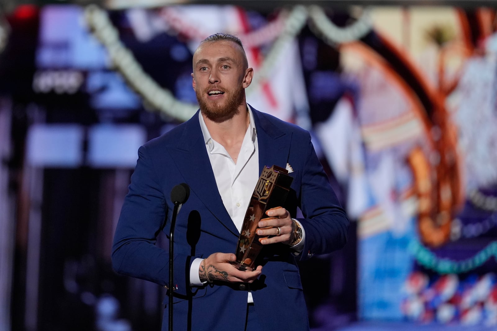 San Francisco 49ers' George Kittle accepts the Salute to service award and speaks during the NFL Honors award show ahead of the Super Bowl 59 football game, Thursday, Feb. 6, 2025, in New Orleans. (AP Photo/David J. Phillip)