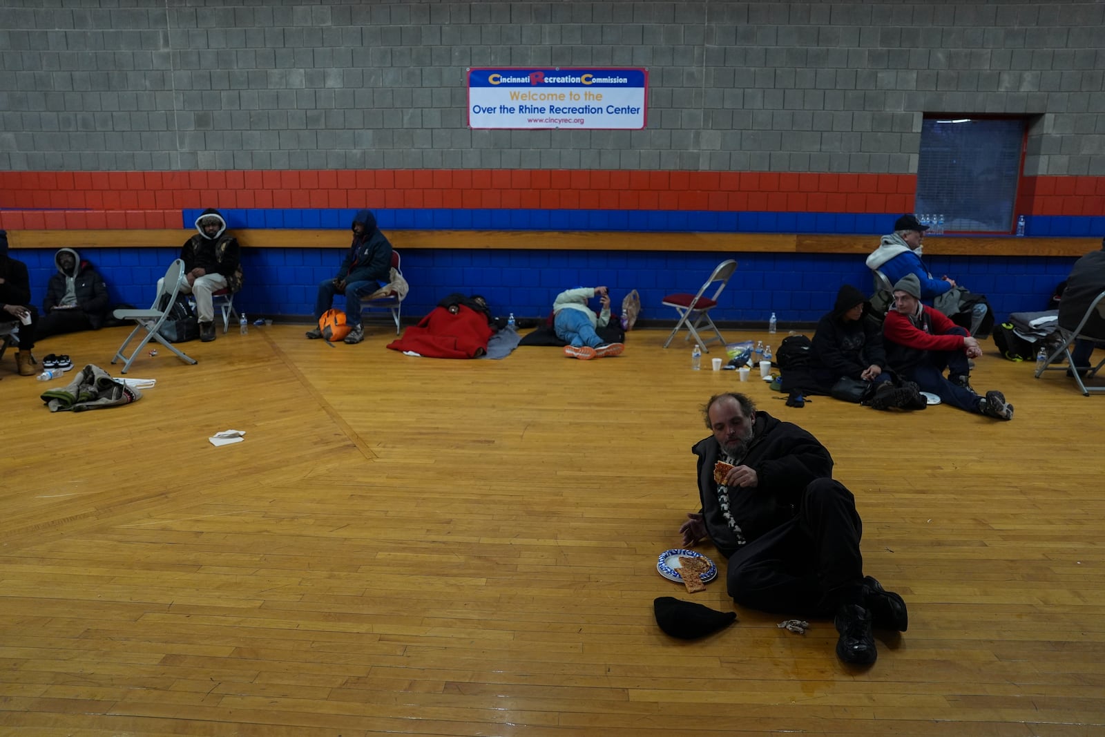 Patrons shelter from the cold inside a recreation center, Monday, Jan. 6, 2025, in Cincinnati. (AP Photo/Joshua A. Bickel)