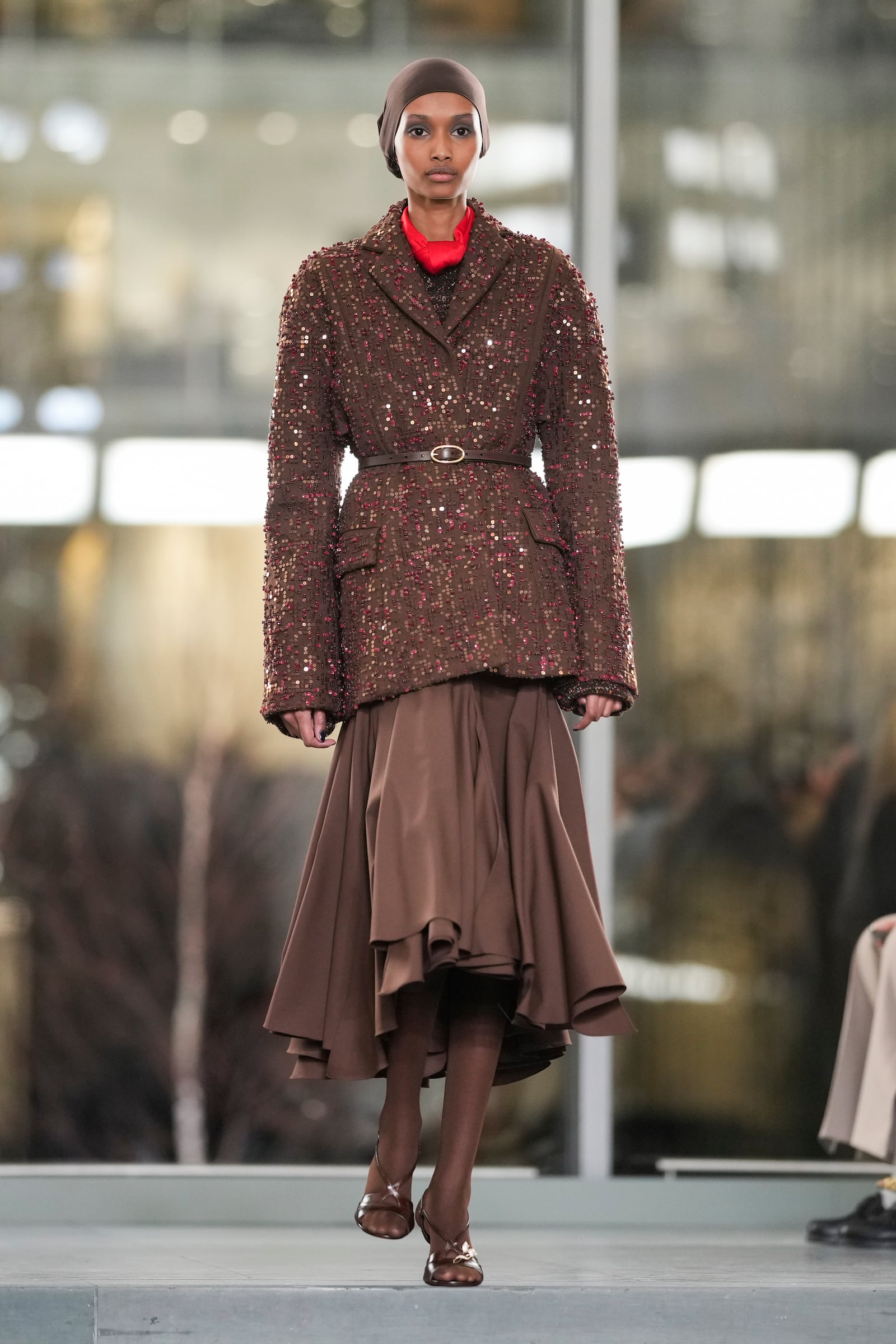 A model walks the runway during the Tory Burch Fall/Winter 2025 fashion show as part of New York Fashion Week on Monday, Feb. 10, 2025, at the Museum of Modern Art in New York. (Photo by Charles Sykes/Invision/AP)