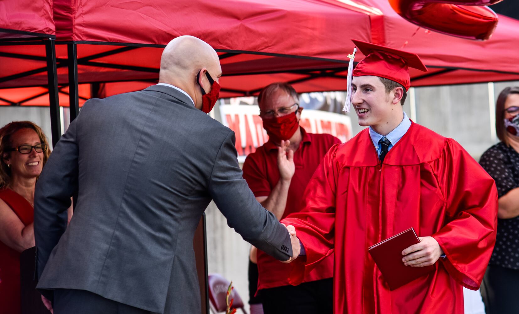 Madison High School drive-thru graduation ceremony at Land of Illusion