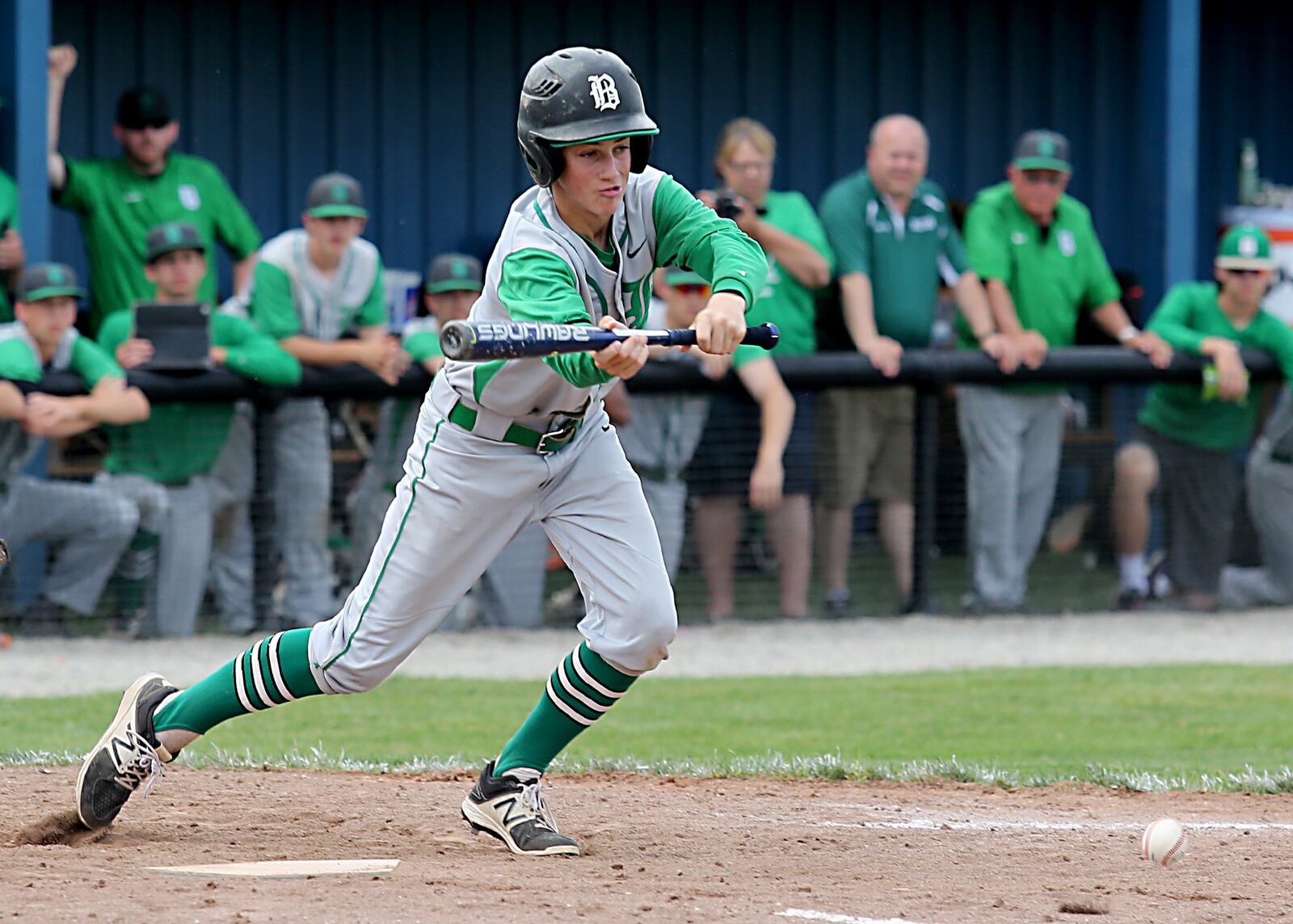 Badin’s Sam Mathews puts down a sacrifice bunt Thursday during a Division II sectional final against Chaminade Julienne at Miamisburg. CONTRIBUTED PHOTO BY E.L. HUBBARD