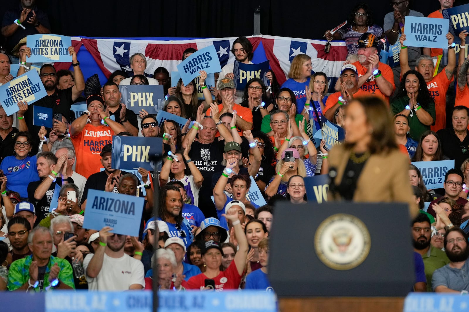 The crowd reacts as Democratic presidential nominee Vice President Kamala Harris speaks Thursday, Oct. 10, 2024, on the Gila River Indian Community reservation near Chandler, Ariz. (AP Photo/Matt York)