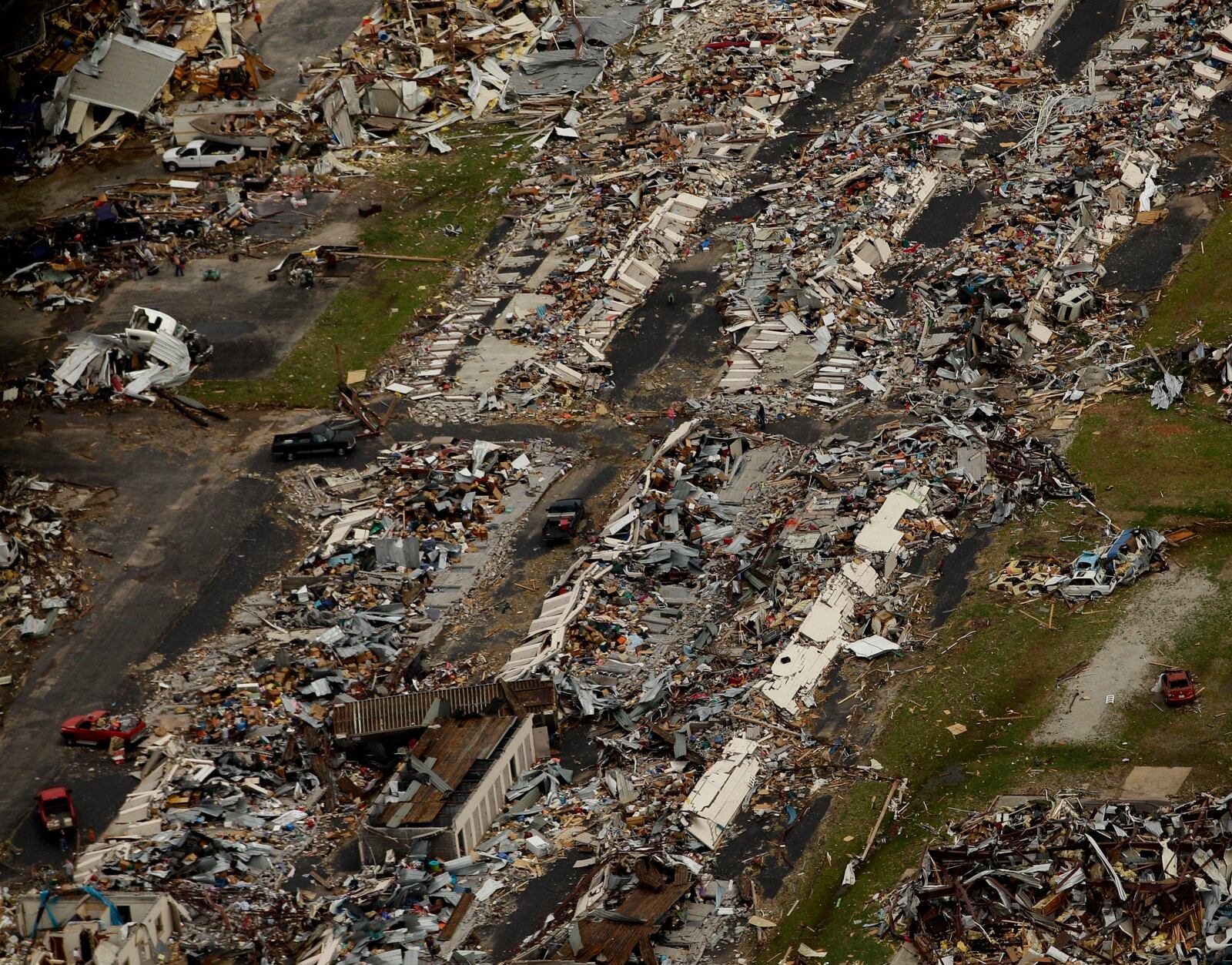 FILE- In this May 24, 2011 file photo, a destroyed neighborhood is seen in Joplin, Mo. (AP Photo/Charlie Riedel, File)