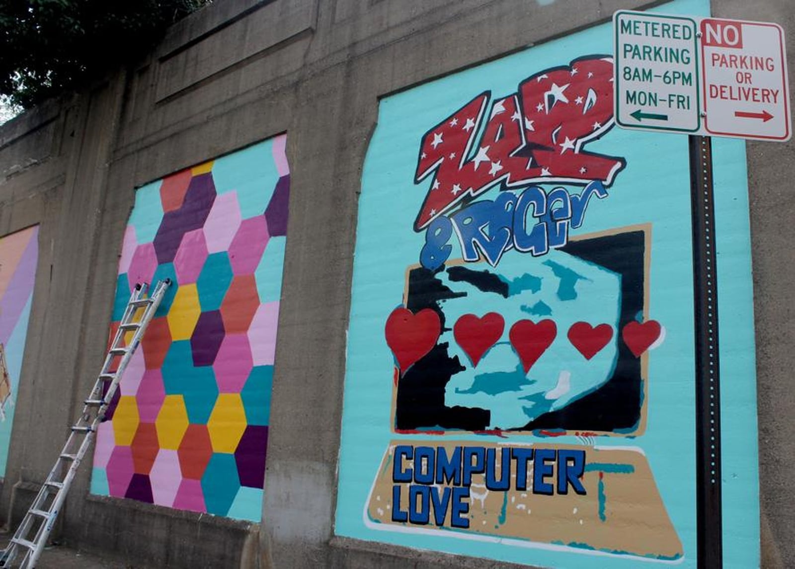 Dayton artist Morris Howard and Brittini Long of Montgomery County Juvenile Court are leading an effort to create a funk wall on Stone Street. AMELIA ROBINSON/STAFF