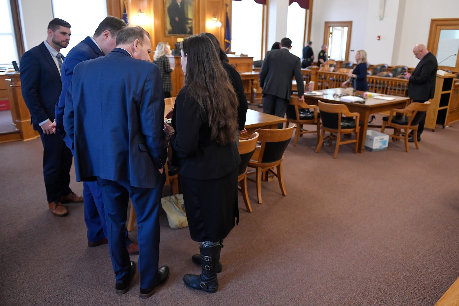 The defense team for Hadi Matar, left, huddles in Chautauqua County court in Mayville, N.Y., Thursday, Feb. 20, 2025. Matar is charged with severely injuring author Salman Rushdie in a 2022 knife attack. (AP Photo/Adrian Kraus)