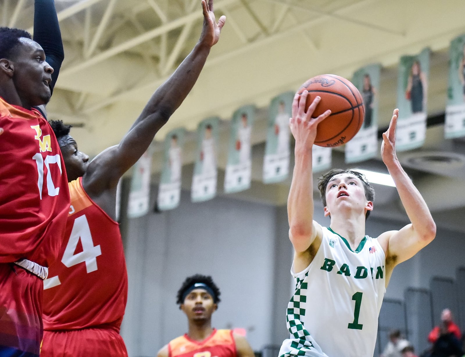 Badin’s Joseph Walsh goes up for a shot against Purcell Marian’s Alex Dotson (10) and Bryan Warah (24) during Friday night’s game at Mulcahey Gym in Hamilton. Purcell won 64-52. NICK GRAHAM/STAFF