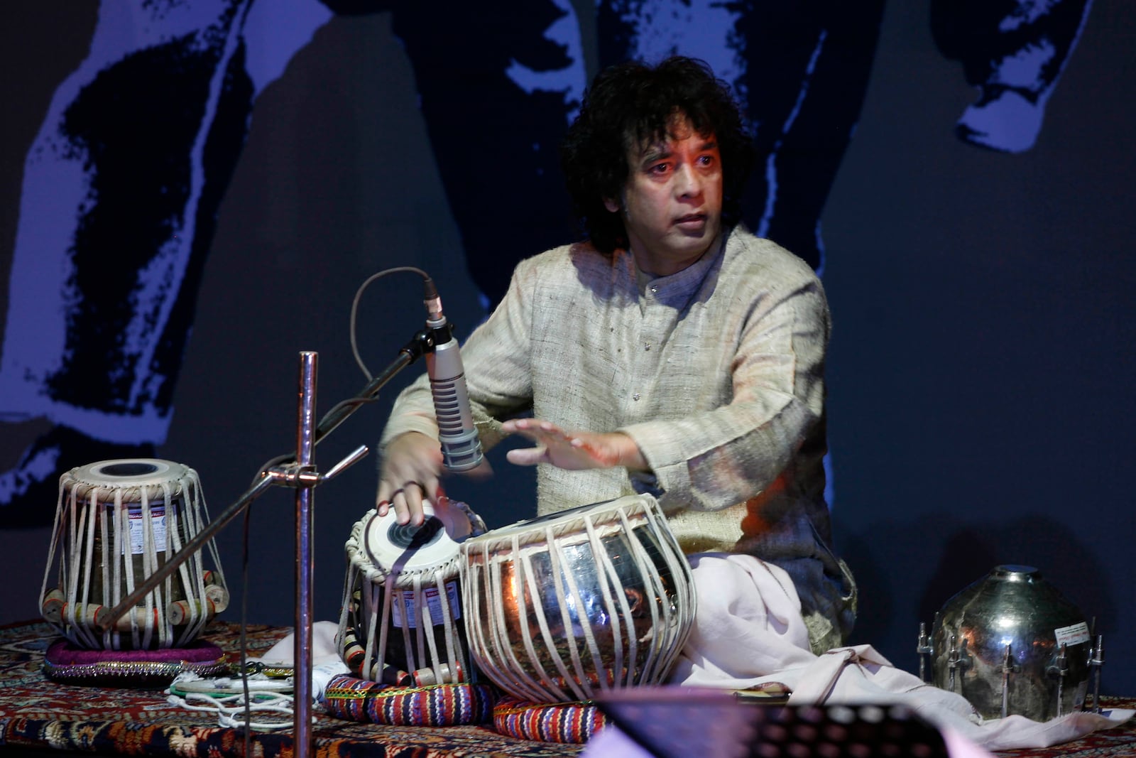 FILE - Indian drum maestro Zakir Hussain performs at the "Living Dream Concert" in New Delhi, India, on Feb. 16, 2009. (AP Photo/Mustafa Quraishi, File)