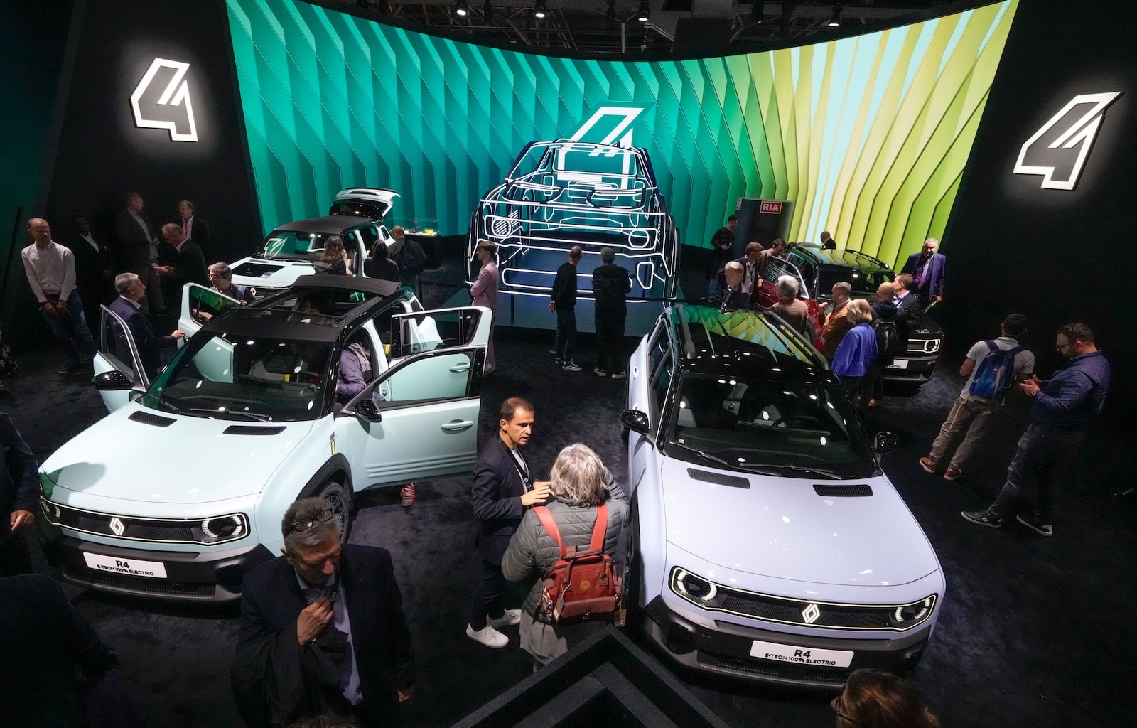 Renault R4 E-TECH cars are presented at the Paris Auto Show, in Paris, Monday, Oct. 14, 2024. (AP Photo/Michel Euler)