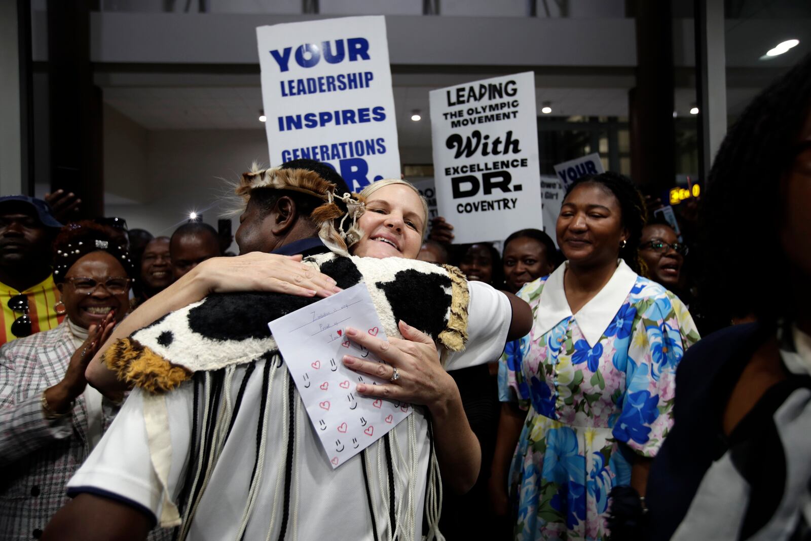 Newly elected International Olympic Committee IOC President Kirsty Coventry welcomed by officials at the Robert Gabriel Mugabe Airport in Harare, Zimbabwe, Sunday, March 23, 2025. (AP Photo/Aaron Ufumeli)