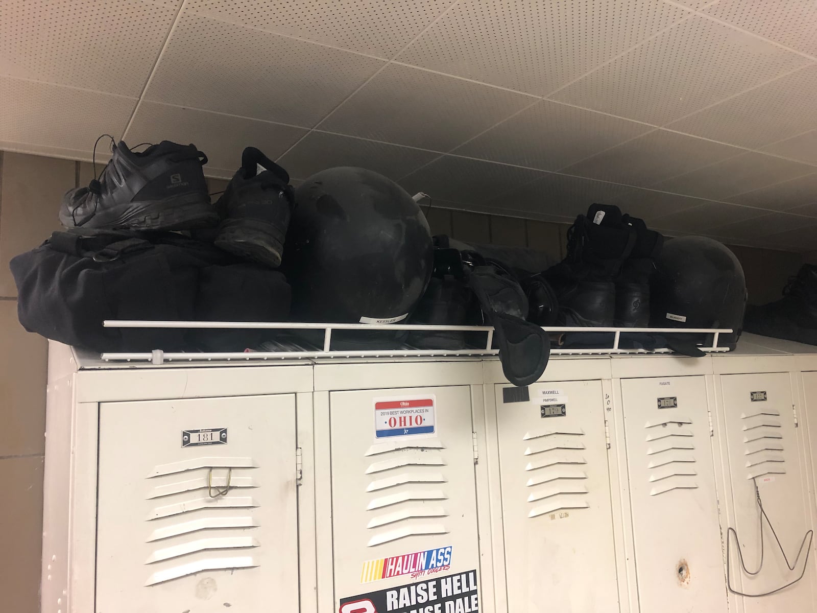 Due to the small size of the lockers in the Middletown Division of Police locker room some officers store equipment above their lockers. RICK McCRABB/STAFF