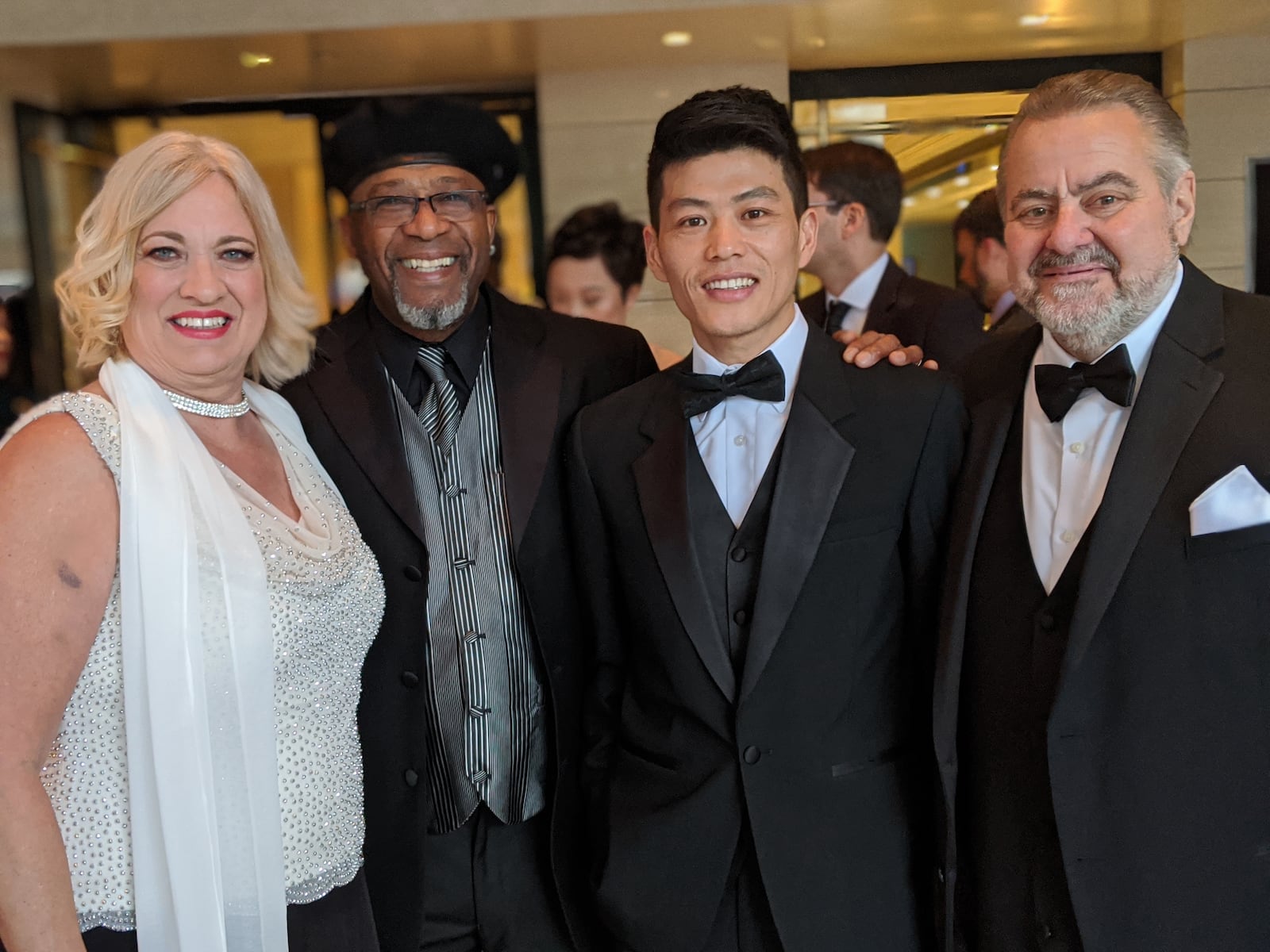 Jill Lamantia, Bobby Allen, Wong He and Rob Haerr on Oscar night. Their stories were featured in "American Factory." SARA LAMANTIA/CONTRIBUTED