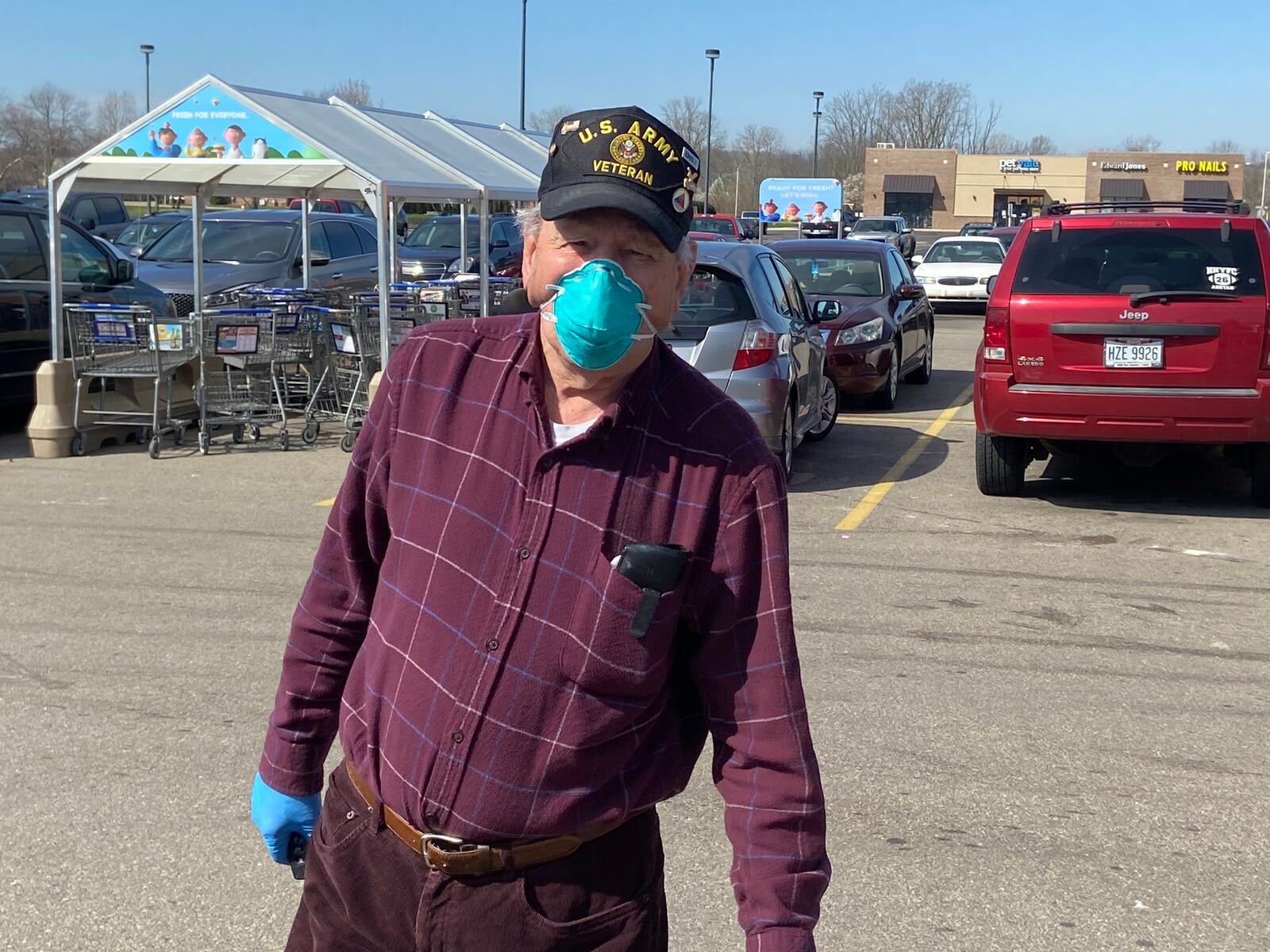 Robert Preston of Fairborn wore a mask and gloves while shopping at the Kroger grocery store on Dayton-Yellow Springs Street recently. The Army veteran said everyone should be required to wear a mask to slow the spread of COVID-19.