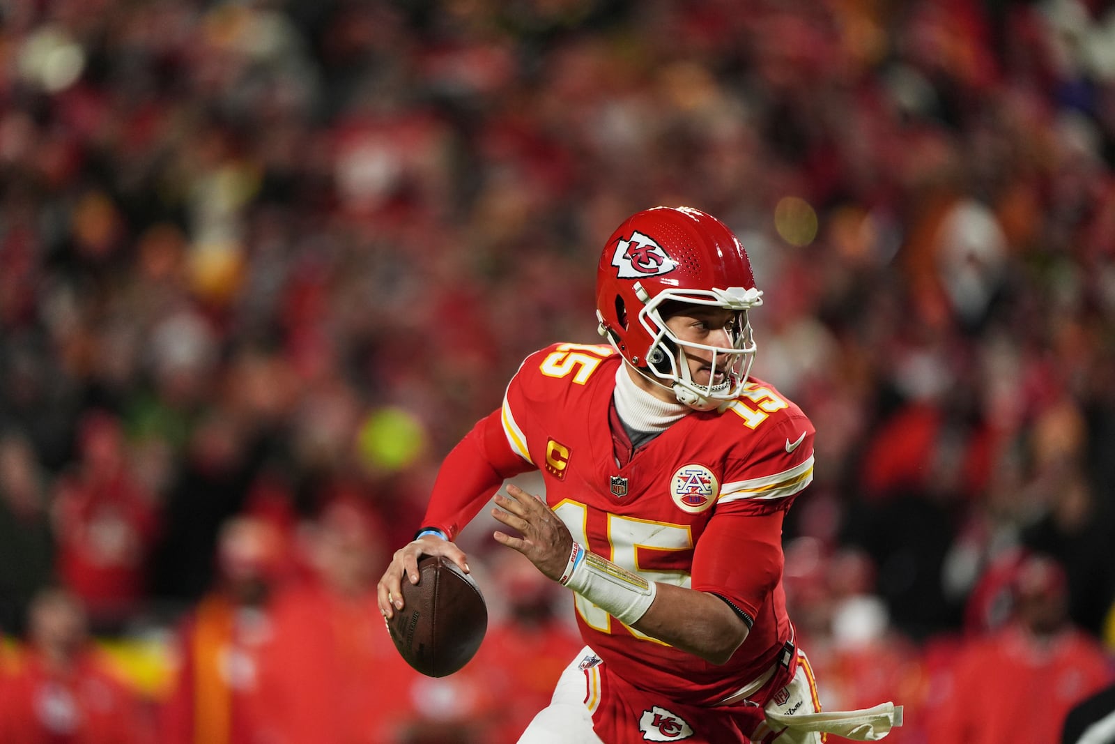 Kansas City Chiefs quarterback Patrick Mahomes (15) scrambles for a touchdown during the first half of the AFC Championship NFL football game, Sunday against the Buffalo Bills, Jan. 26, 2025, in Kansas City, Mo. (AP Photo/Charlie Riedel)