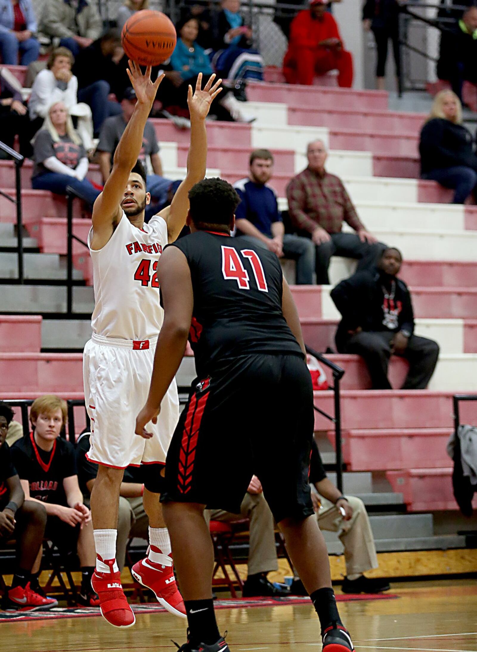 Fairfield forward Ben Phillips shoots over Colerain’s Tahj Roberts during Tuesday night’s game at Fairfield Arena. CONTRIBUTED PHOTO BY E.L. HUBBARD