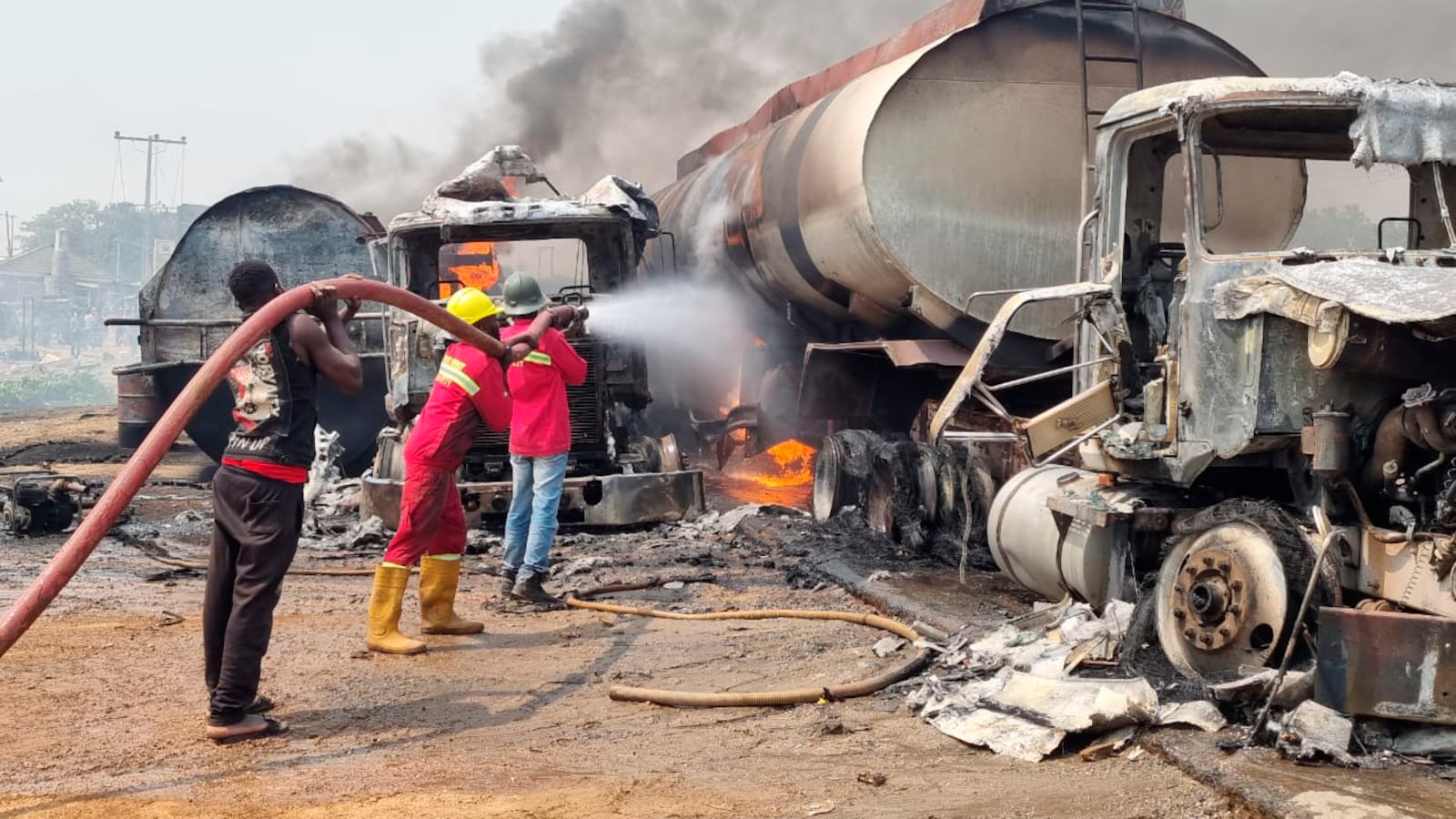 Firefighters extinguish fire from a tanker that exploded in Suleja, Nigeria, Saturday, Jan. 18, 2025. (AP Photo/Arise News)