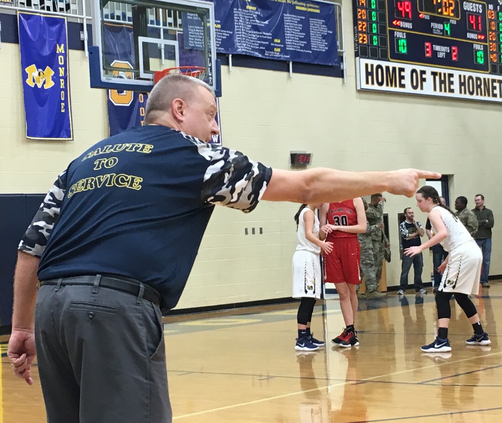 Monroe coach Chad Allen makes a point to one of his players late in Saturday night’s game against visiting Franklin. RICK CASSANO/STAFF