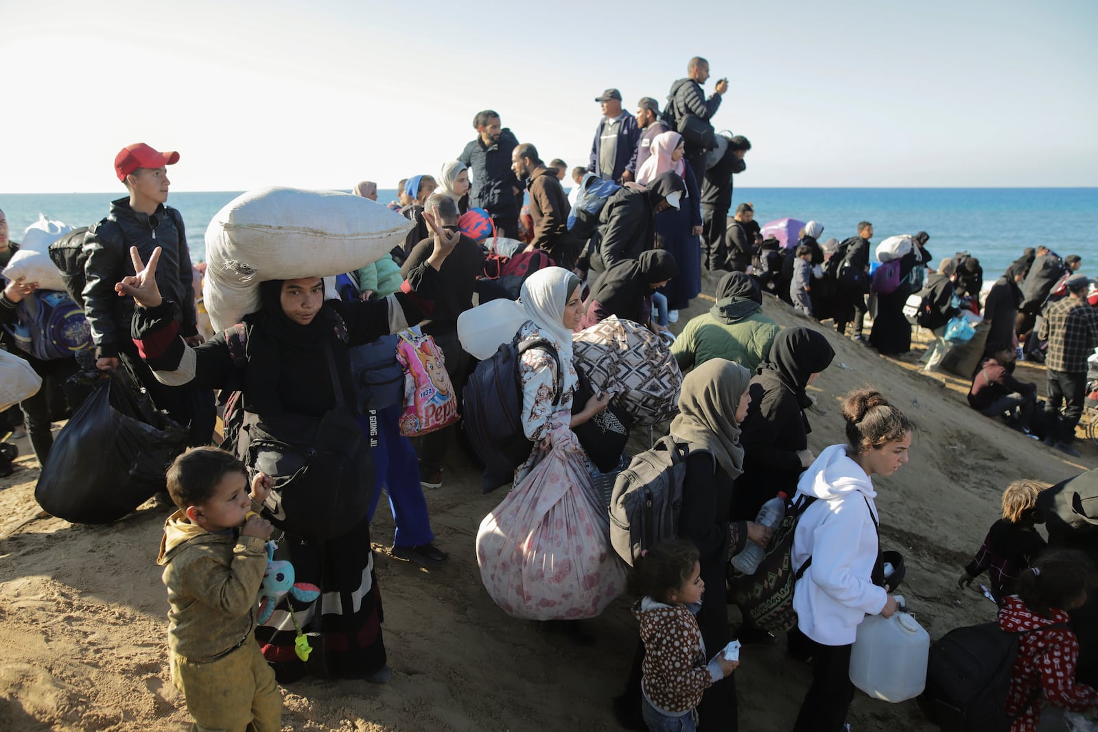 Displaced Palestinians return to their homes in the northern Gaza Strip, following Israel's decision to allow thousands of them to go back for the first time since the early weeks of the 15-month war with Hamas, Monday, Jan. 27, 2025. (AP Photo/Jehad Alshrafi)