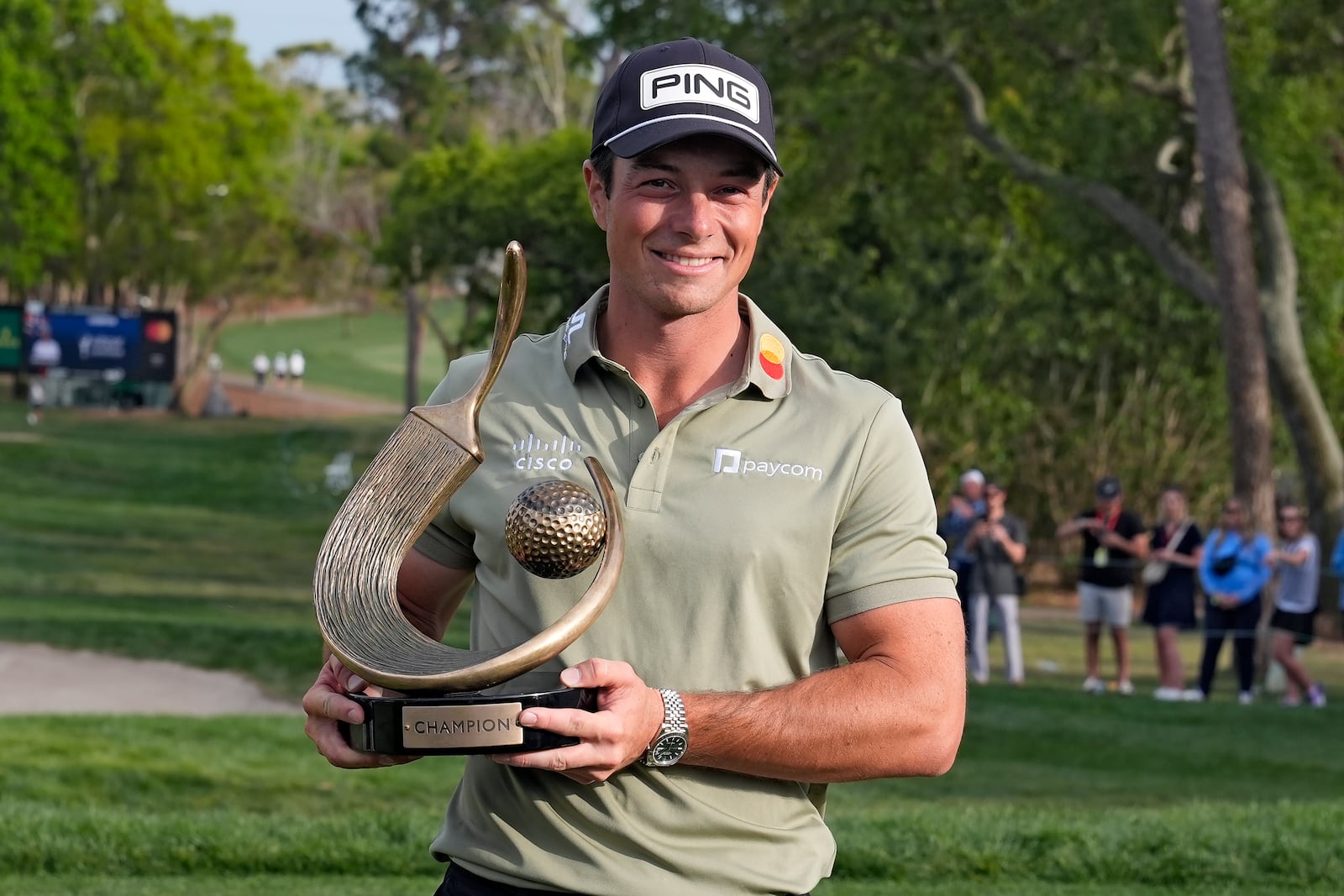 Viktor Hovland, of Norway, poses the with the trophy after winning the Valspar Championship golf tournament Sunday, March 23, 2025, at Innisbrook in Palm Harbor, Fla. (AP Photo/Chris O'Meara)