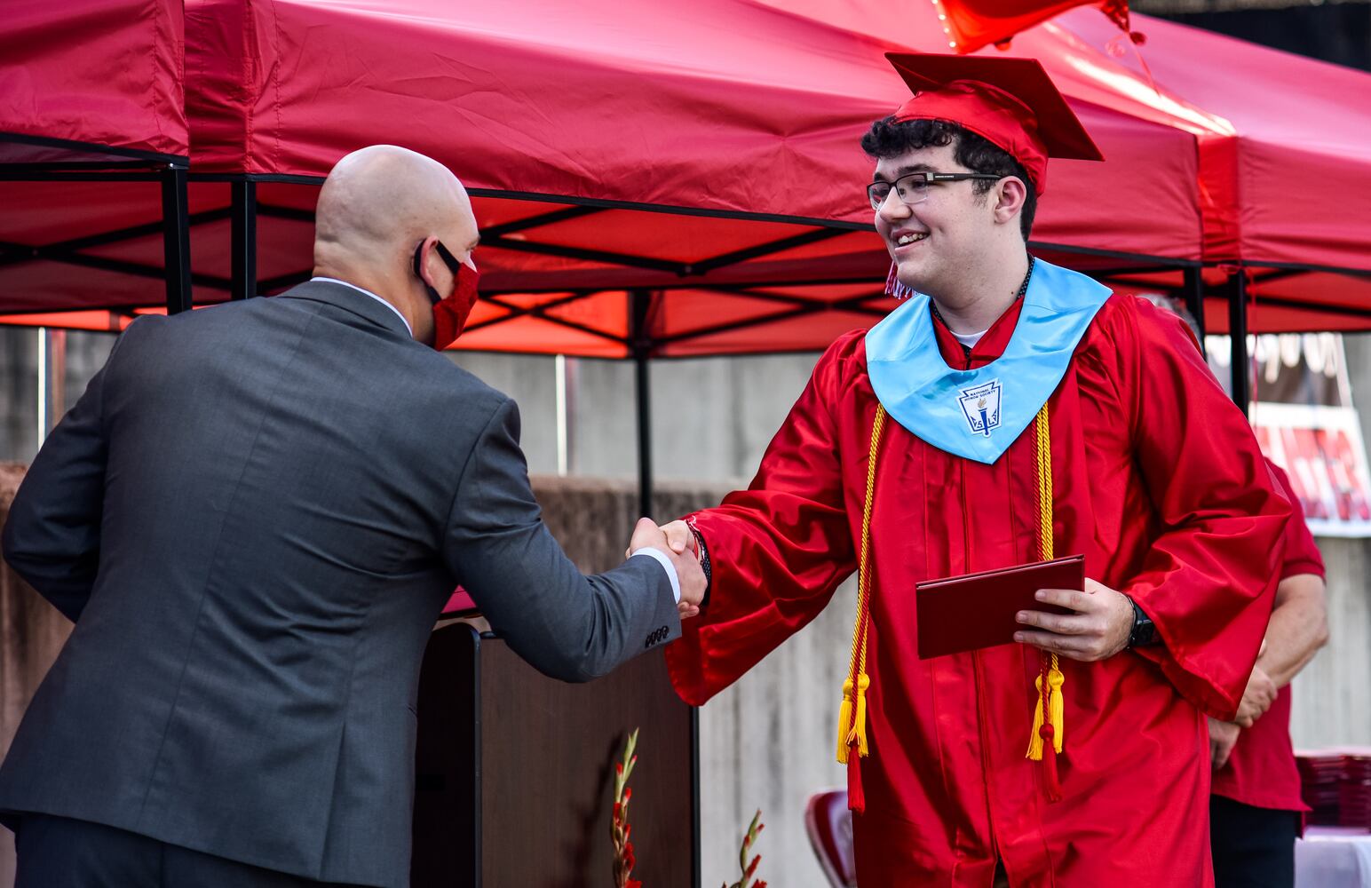 Madison High School drive-thru graduation ceremony at Land of Illusion