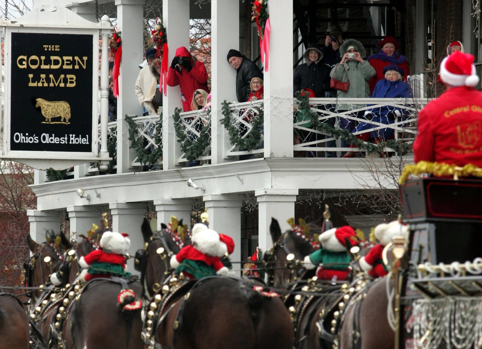 Parade watchers watch the Lebanon Carriage Parade from the balcony of The Golden Lamb, Ohio’s Oldest Hotel. The annual parade features horse-drawn carriages through downtown Lebanon. CONTRIBUTED