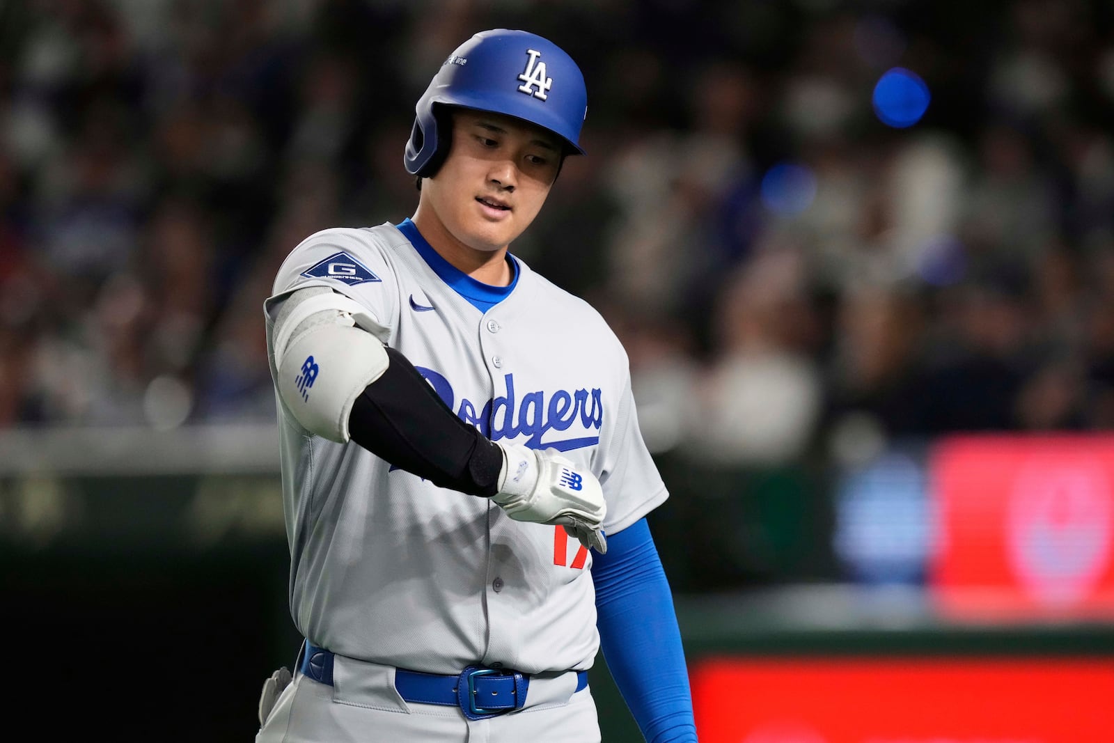 Los Angeles Dodgers' Shohei Ohtani motions through his swing after lining out to second in the third inning of an MLB Japan Series baseball game against the Chicago Cubs in Tokyo, Japan, Tuesday, March 18, 2025. (AP Photo/Eugene Hoshiko)