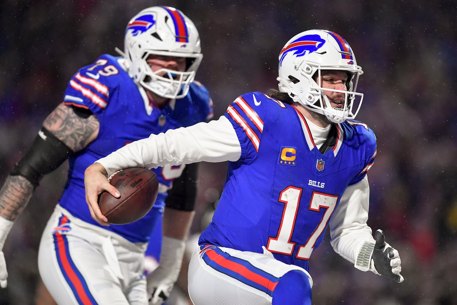 Buffalo Bills quarterback Josh Allen (17) carries the ball into the end zone to score a touchdown against the Baltimore Ravens during the second quarter of an NFL divisional playoff football game, Sunday, Jan. 19, 2025, in Orchard Park, N.Y. (AP Photo/Adrian Kraus)