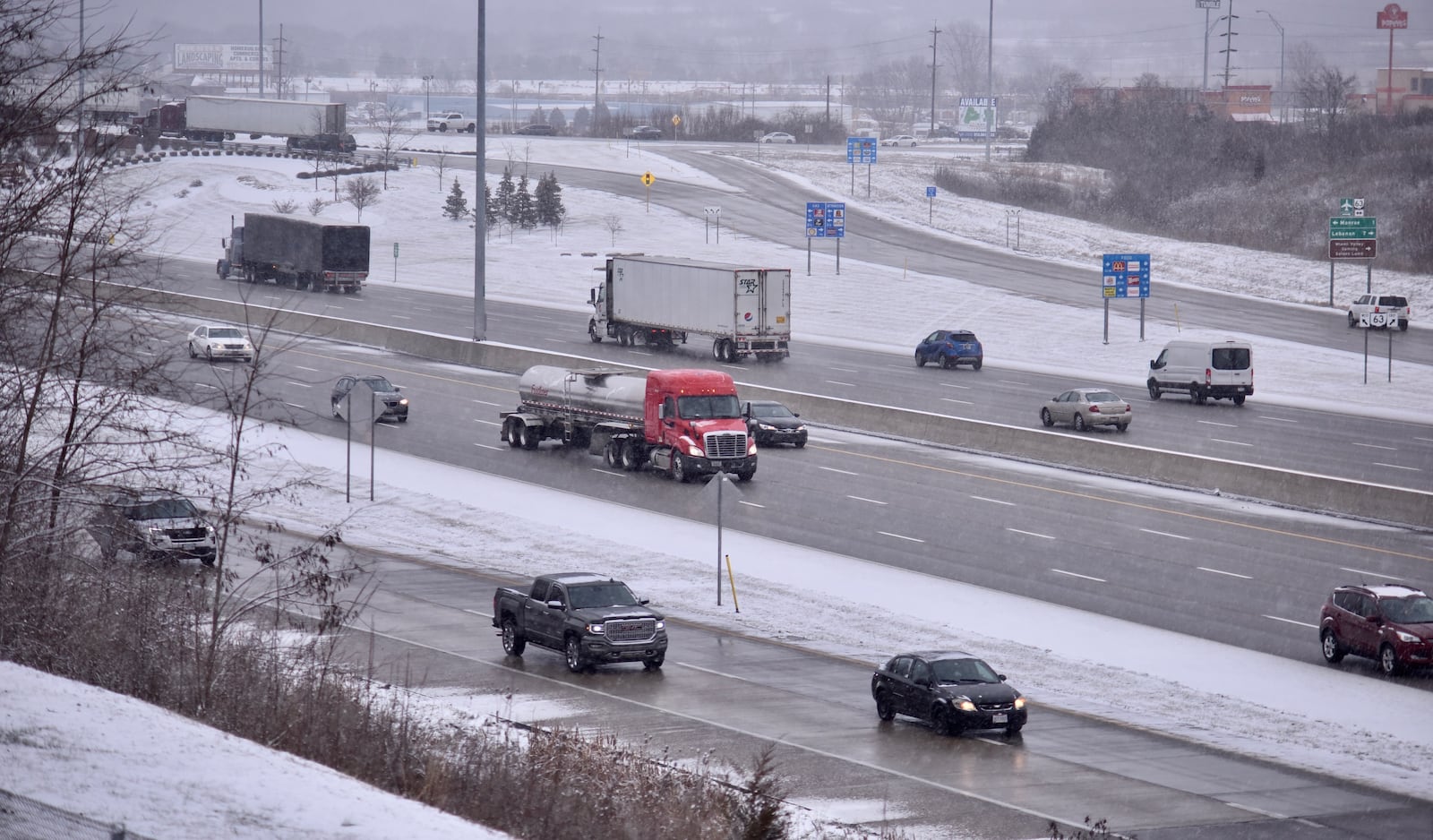 Some traffic was slow around Butler and Warren counties because of winter weather on Friday morning, Feb. 7, 2020, including I-75 near Monroe. NICK GRAHAM / STAFF