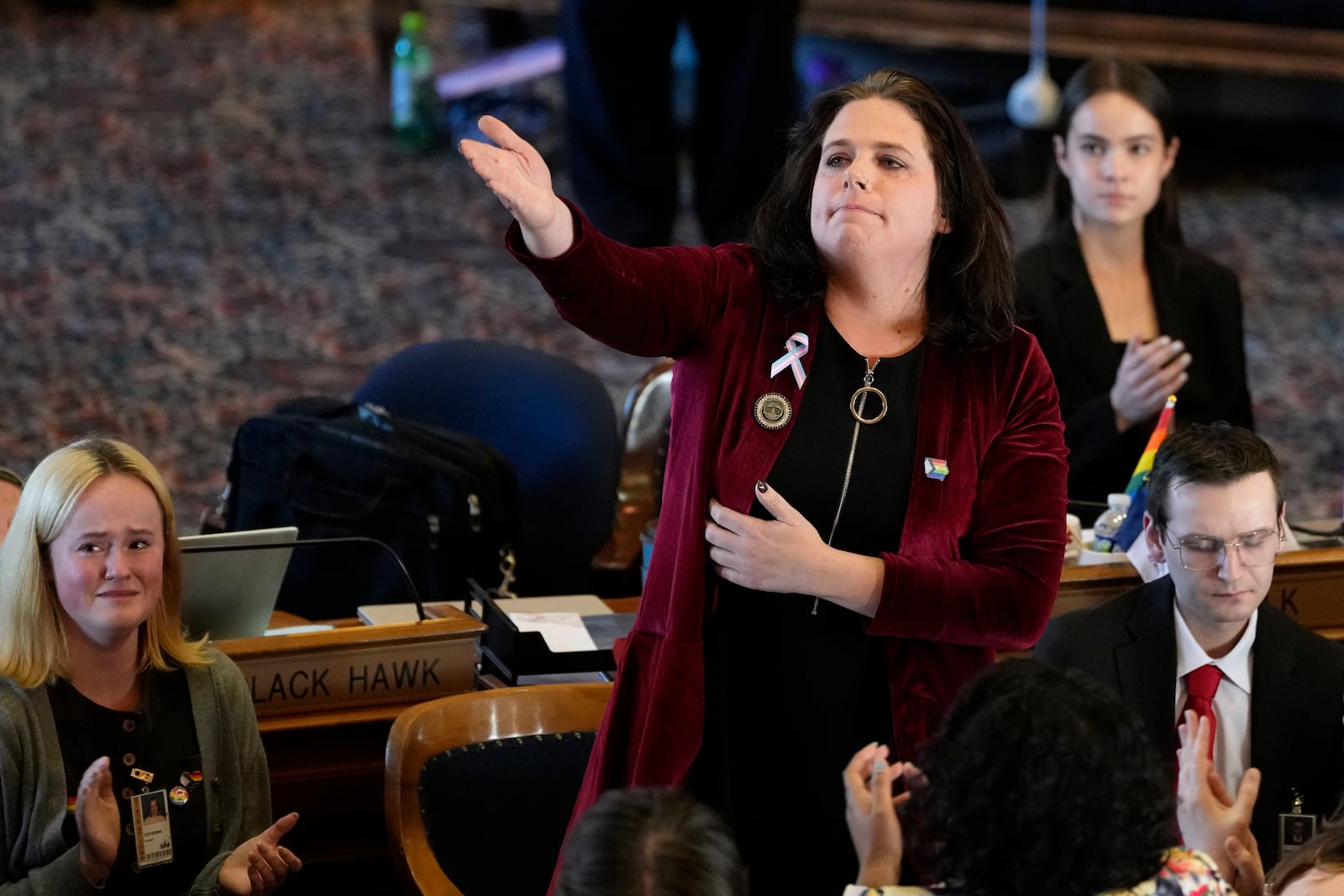 Rep. Aime Wichtendahl, D-Hiawatha, reacts to the gallery after speaking during debate on the gender identity bill, Thursday, Feb. 27, 2025, at the Statehouse in Des Moines, Iowa. (AP Photo/Charlie Neibergall)