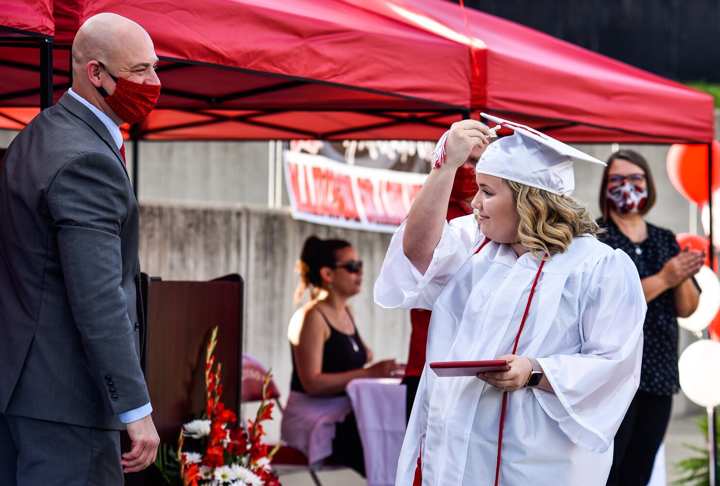 Madison High School drive-thru graduation ceremony at Land of Illusion